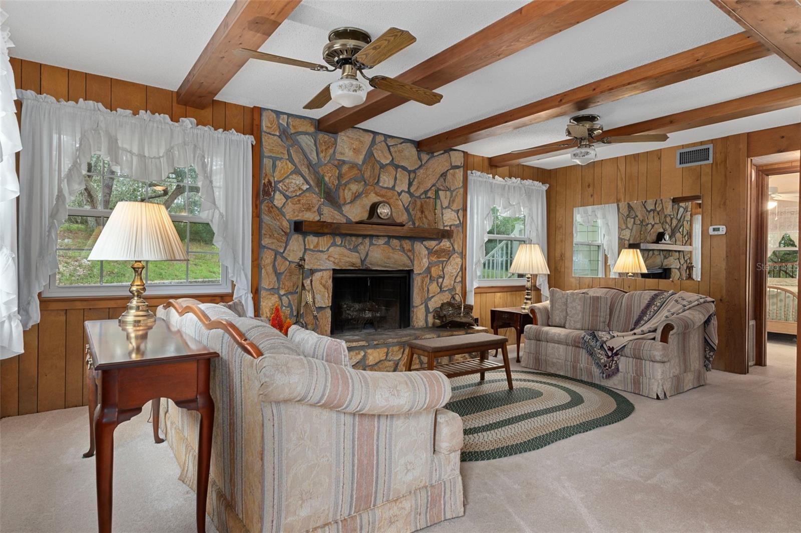 Cozy and comfort is calling you to enjoy your wood burning fireplace in the family room, downstairs