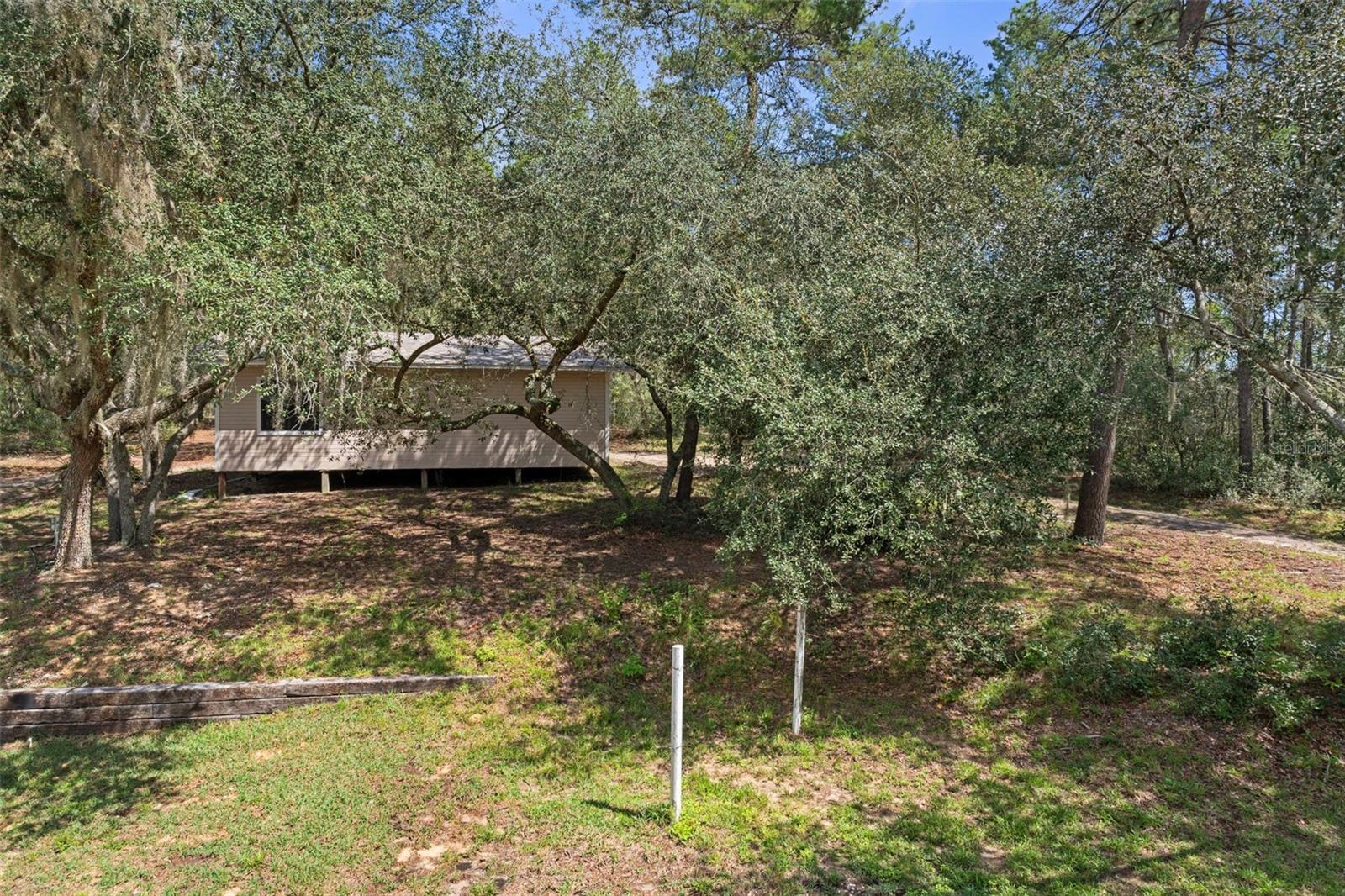 south view-large concrete pad-could be tennis courts