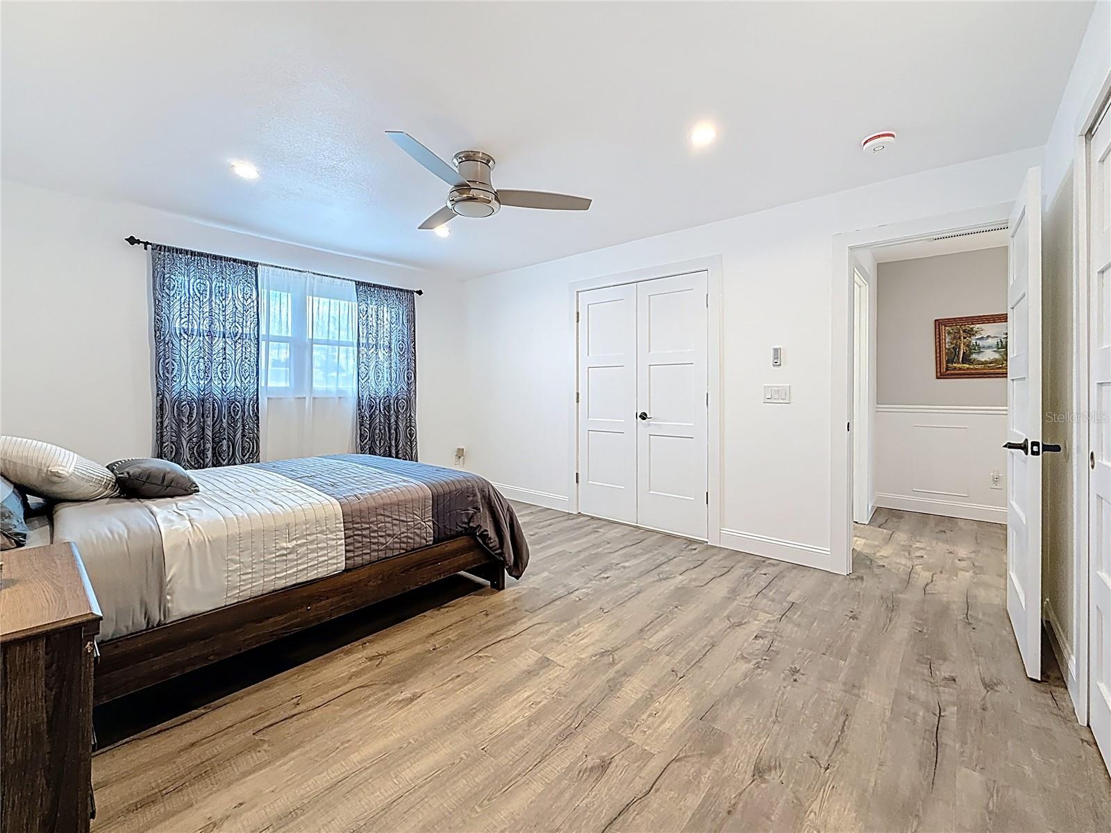 Main bedroom with door to bathroom and hallway