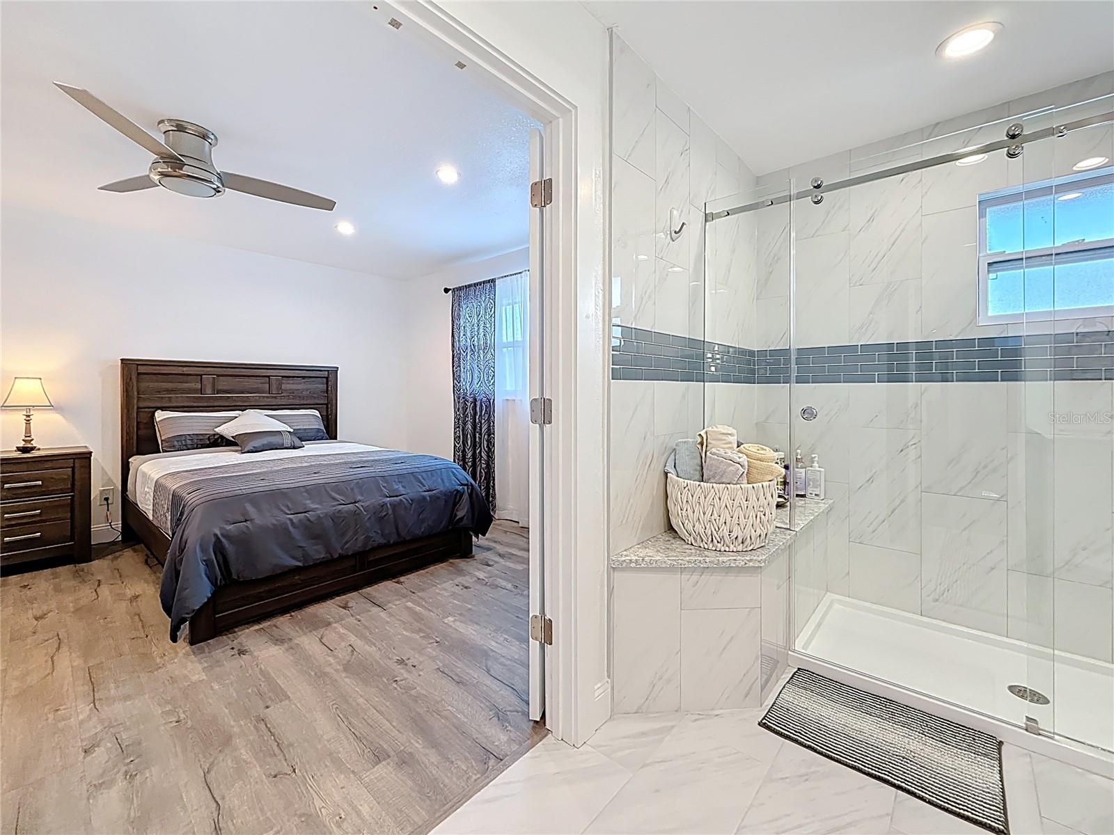 Main bedroom with door to bathroom and hallway