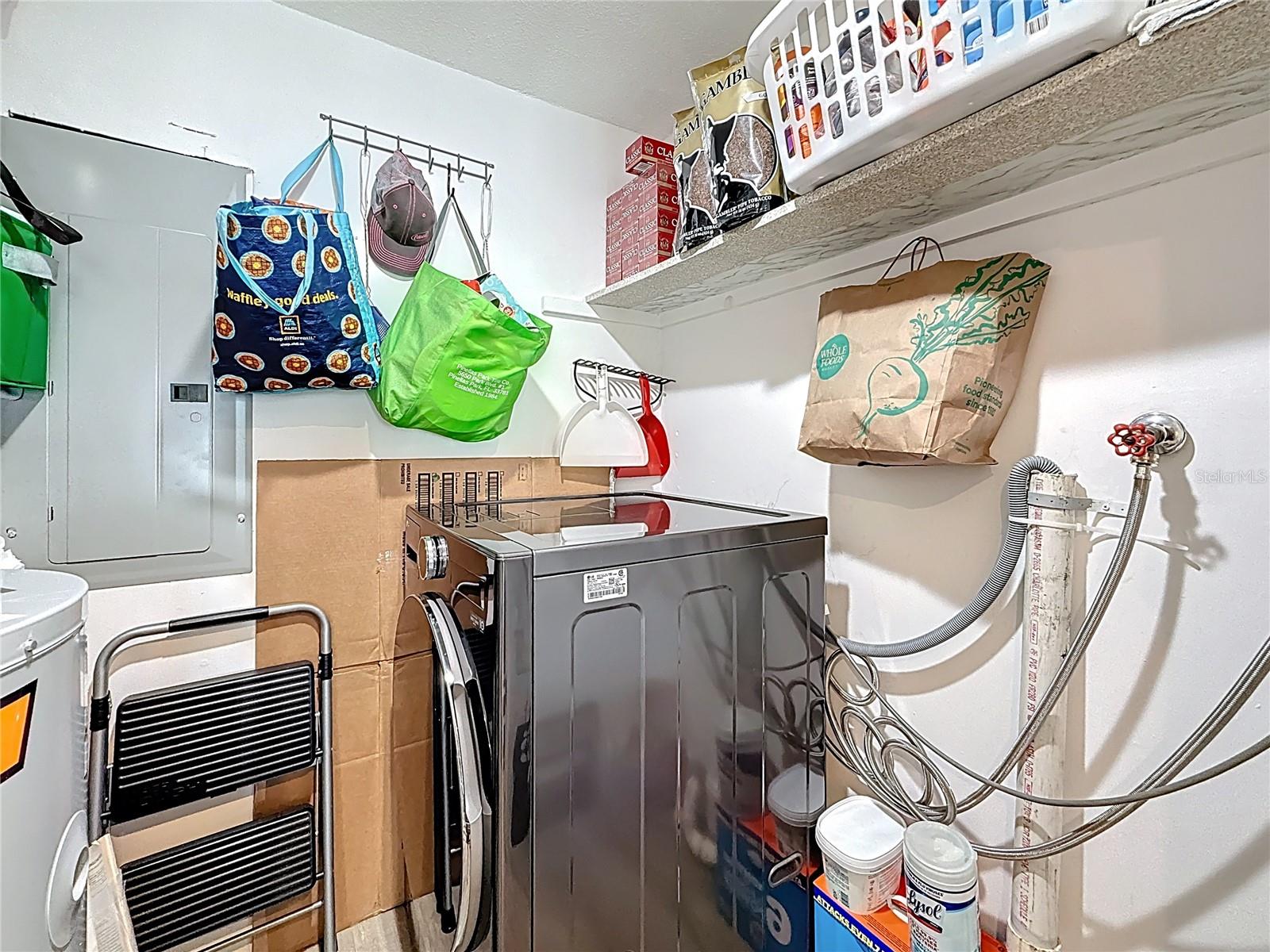 Inside laundry room off kitchen