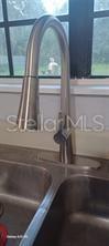 expensive stainless steel pull-off faucet with light...