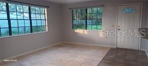 dining rm with expensive travertine flooring...