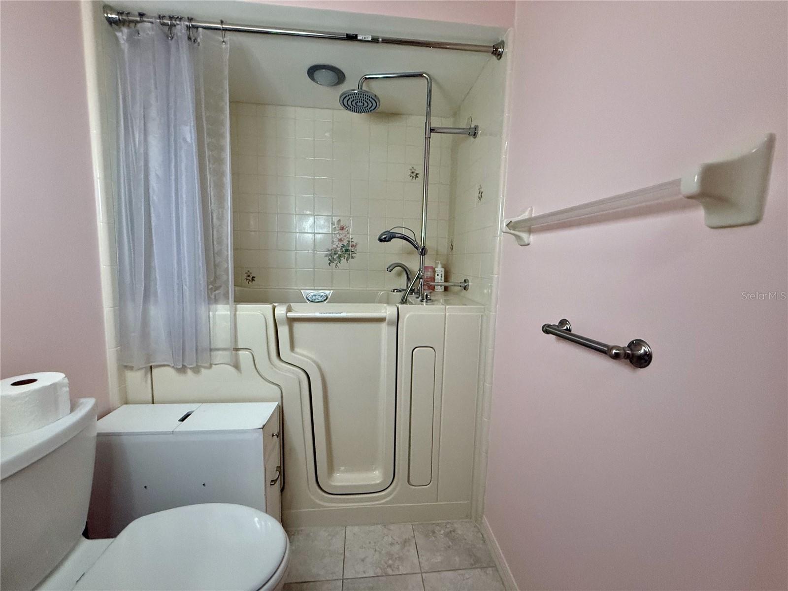 Master bath with upgraded step in shower/tub