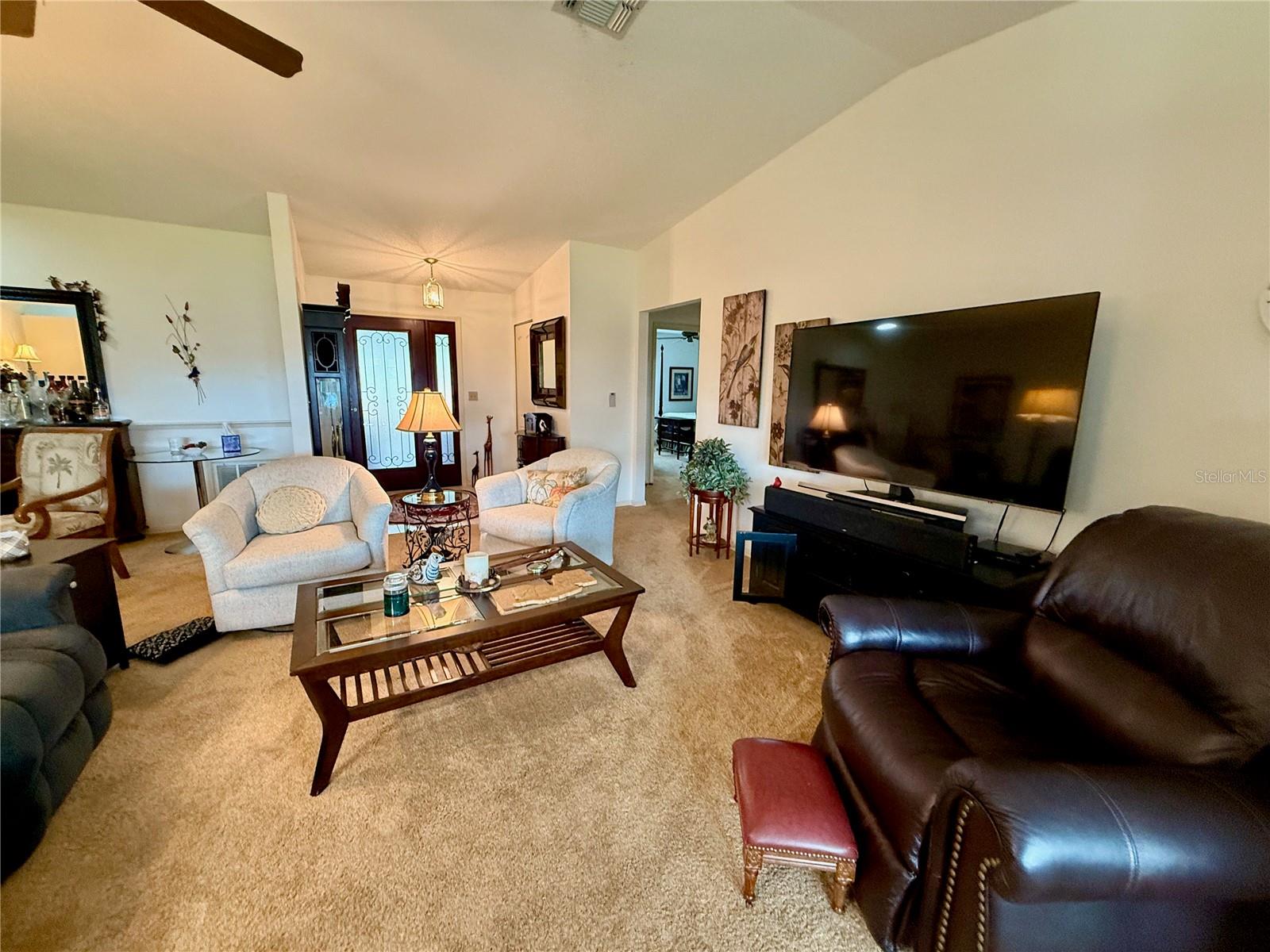 Living room view with entrance in the background