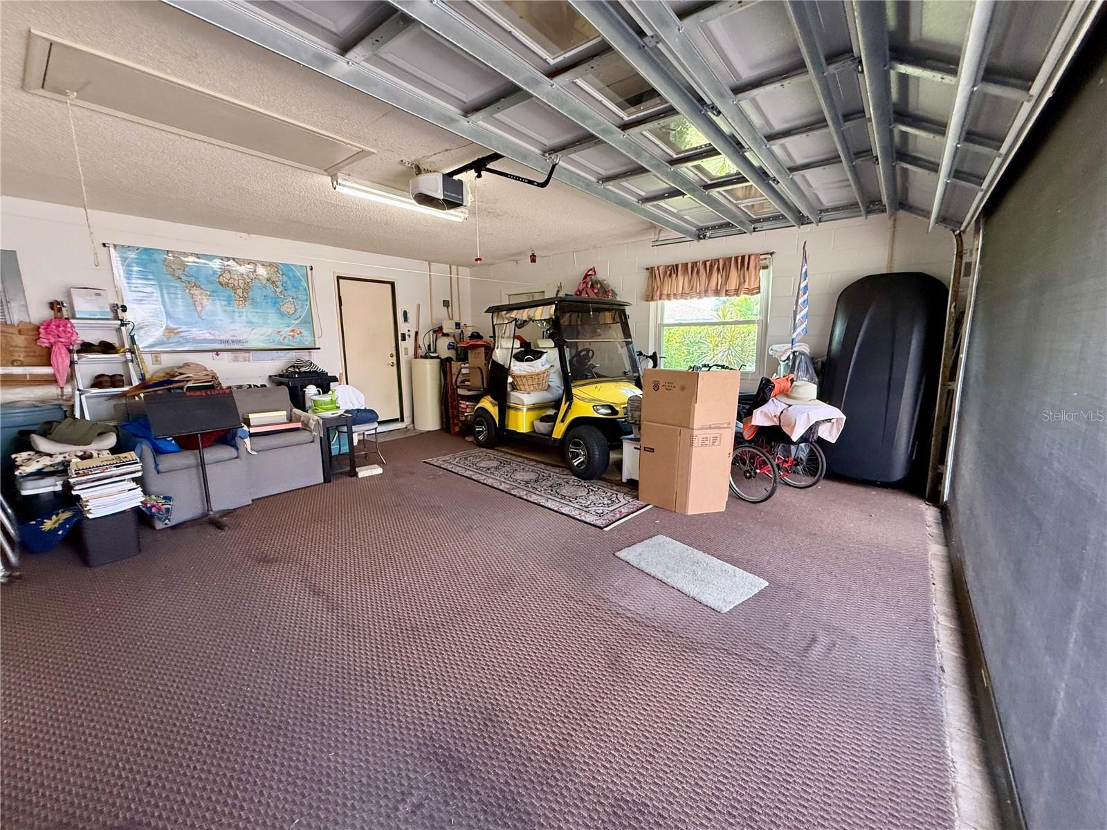 Large two car garage has screen