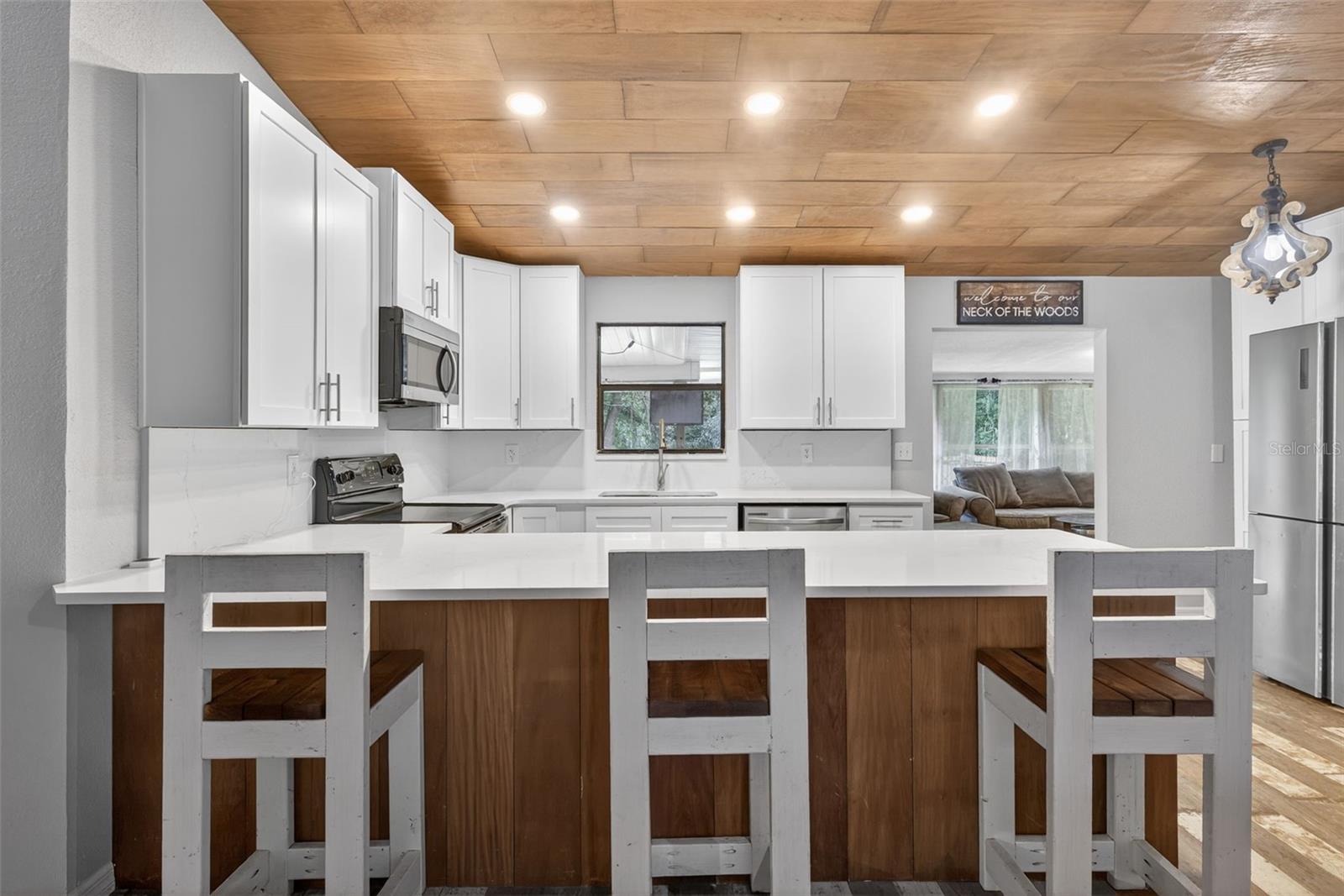 Enjoy entertaining from this lovely light kitchen