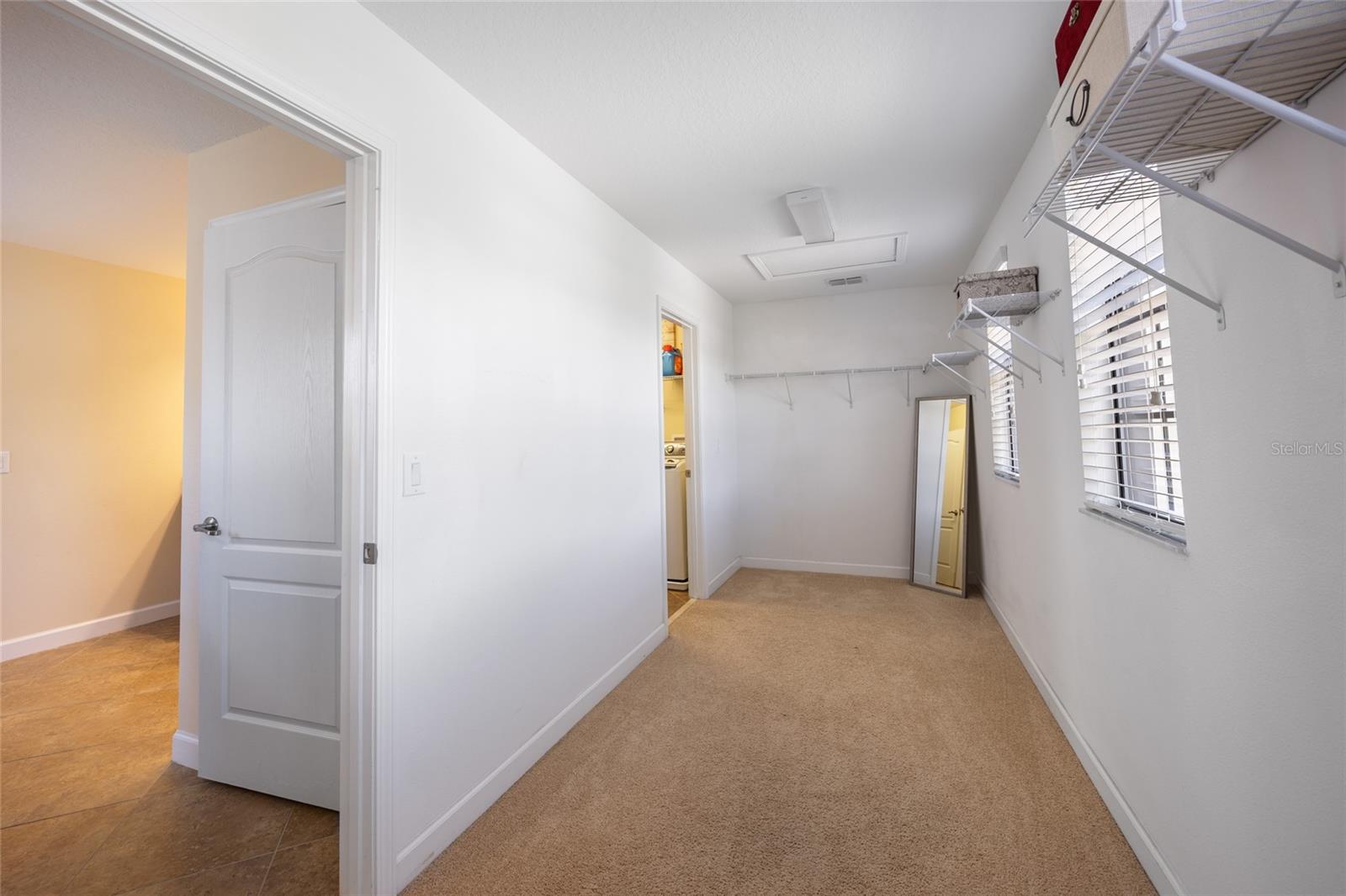 Walk Through Primary Bedroom Closet connecting to Laundry Room