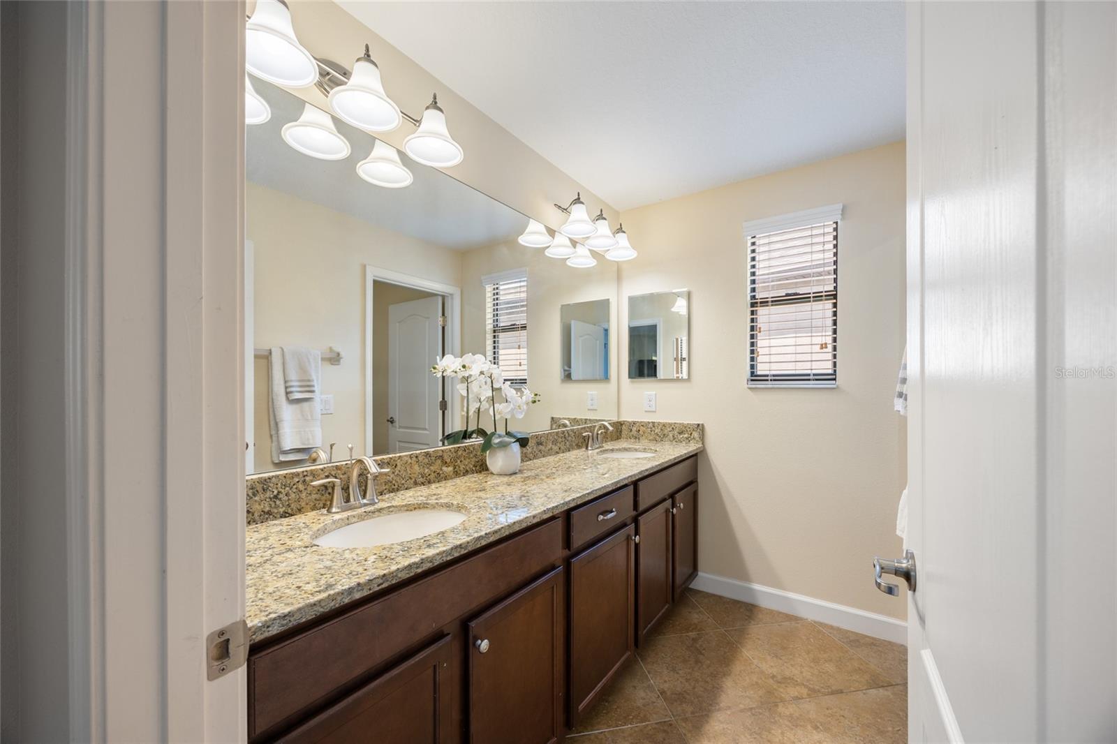 Second Full Bathroom on Second Level with Granite Countertops and Double Sinks