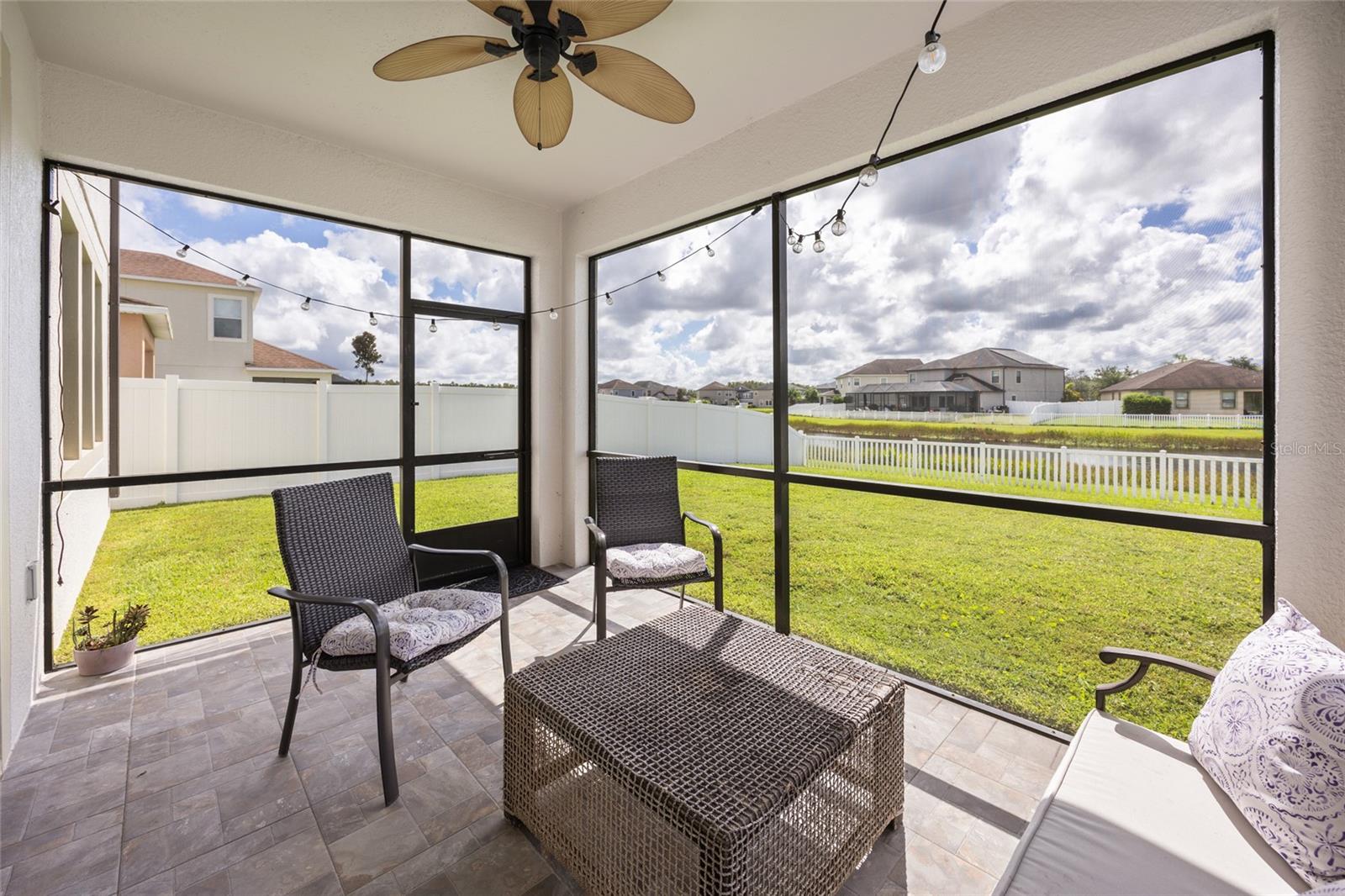 Covered, Screened Back Patio with Updated Tile Pavers