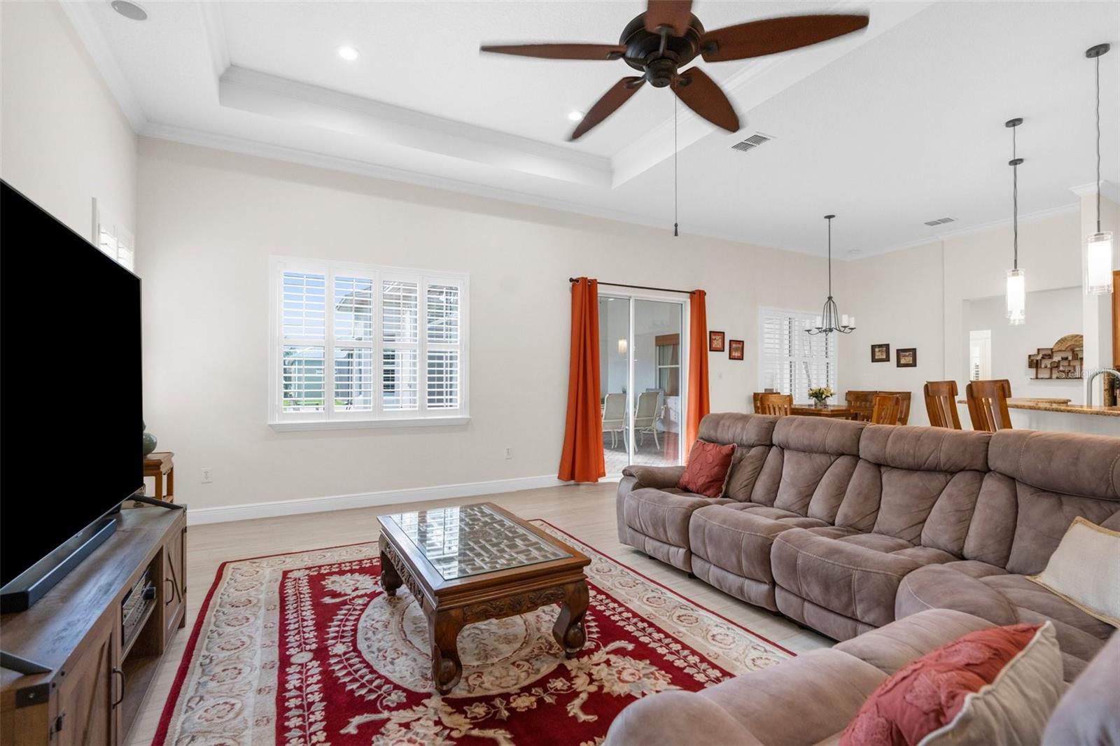 Huge family room area with tray ceiling. Plantation shutters throughout.