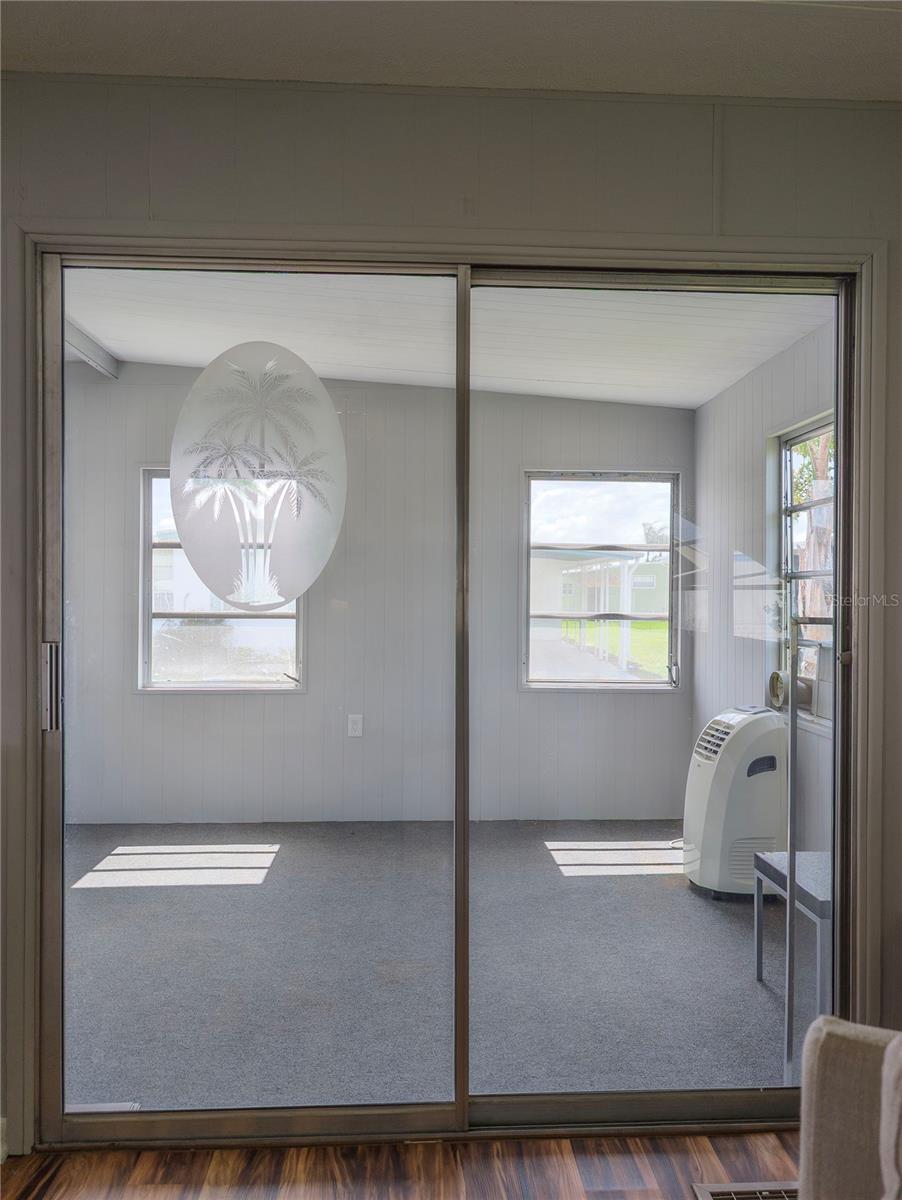New carpet and fresh paint in enclosed porch