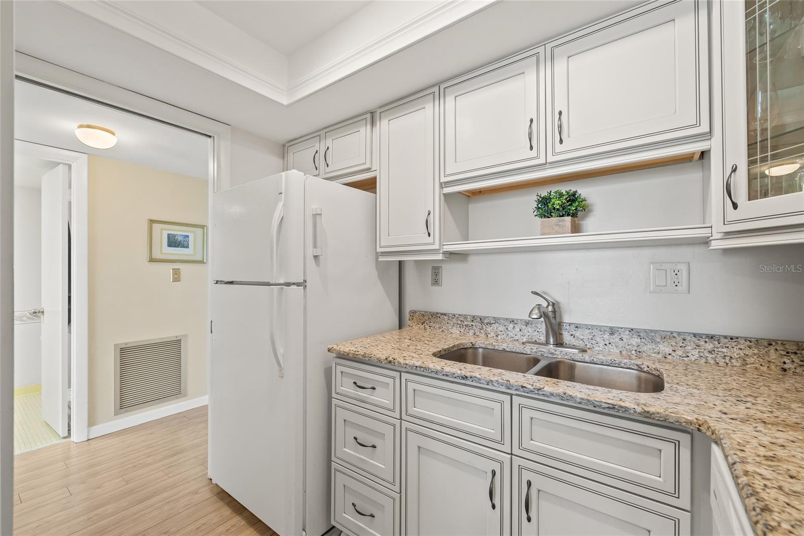 Updated kitchen with granite counter tops.