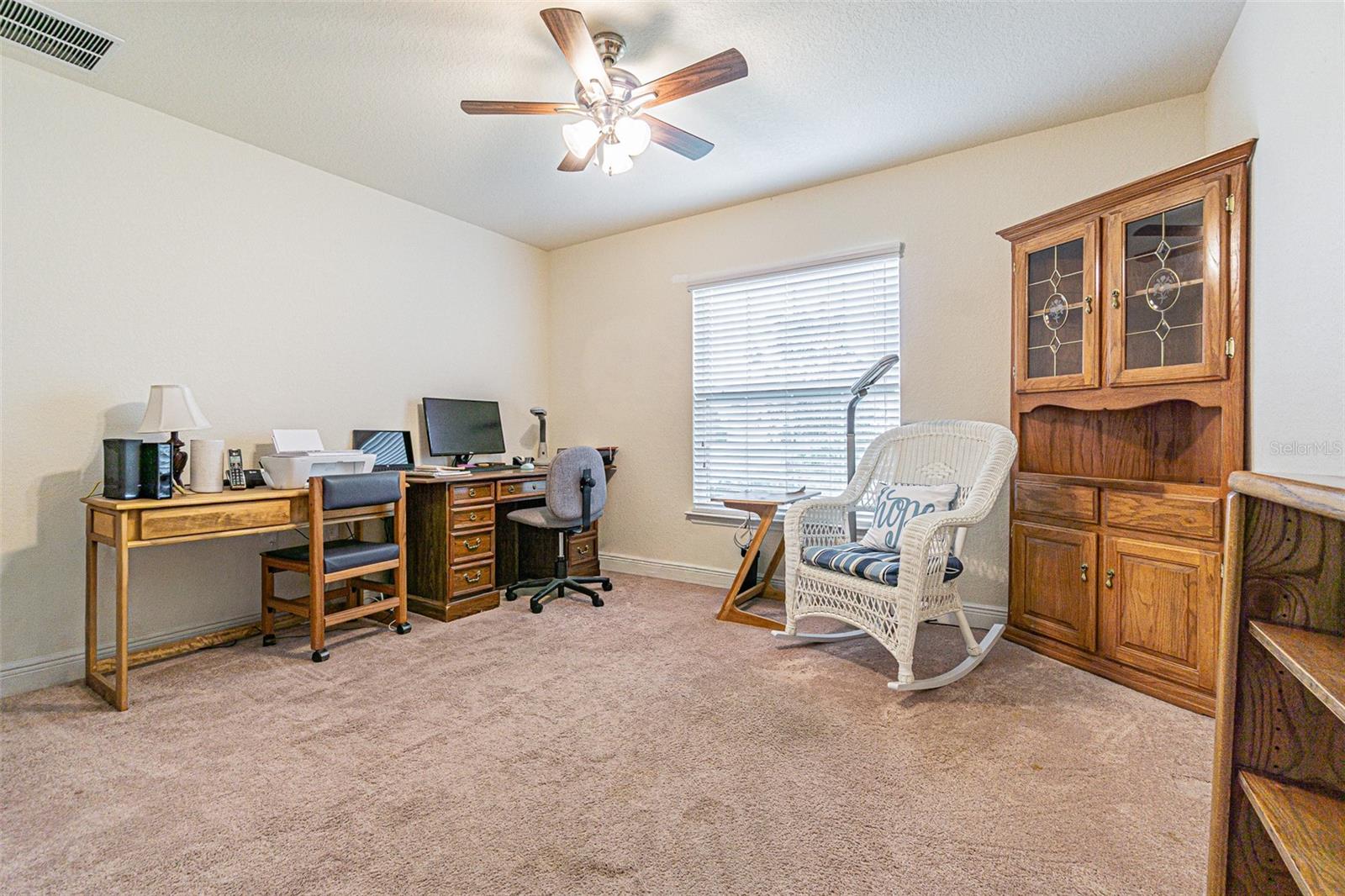 Front FLEX room set up as office/den, with full closet it is really the 4th bedroom