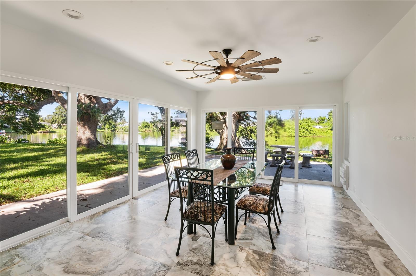 Stunning lakeview from your sunroom. Screen doors still in the box in the garage. All storm rated doors and doggie door leading out to dog pen.