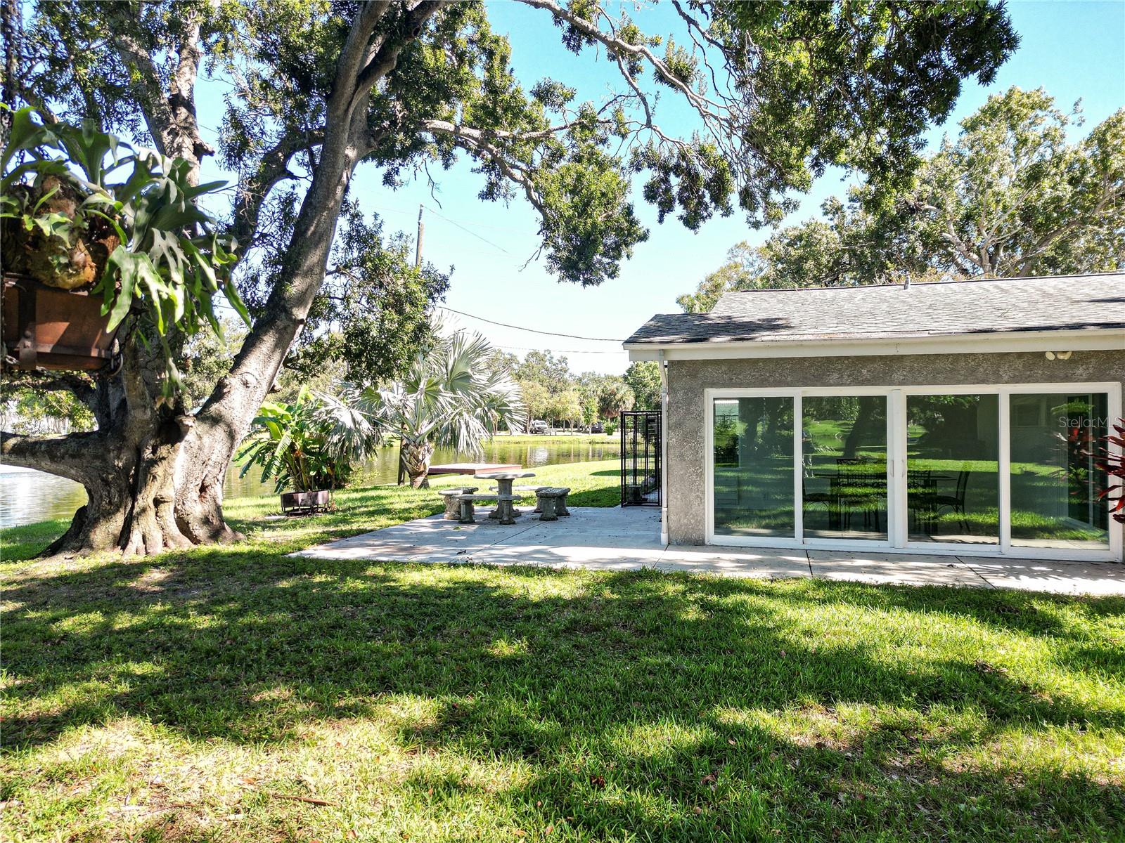 Oversized lakefront patio with firepit.