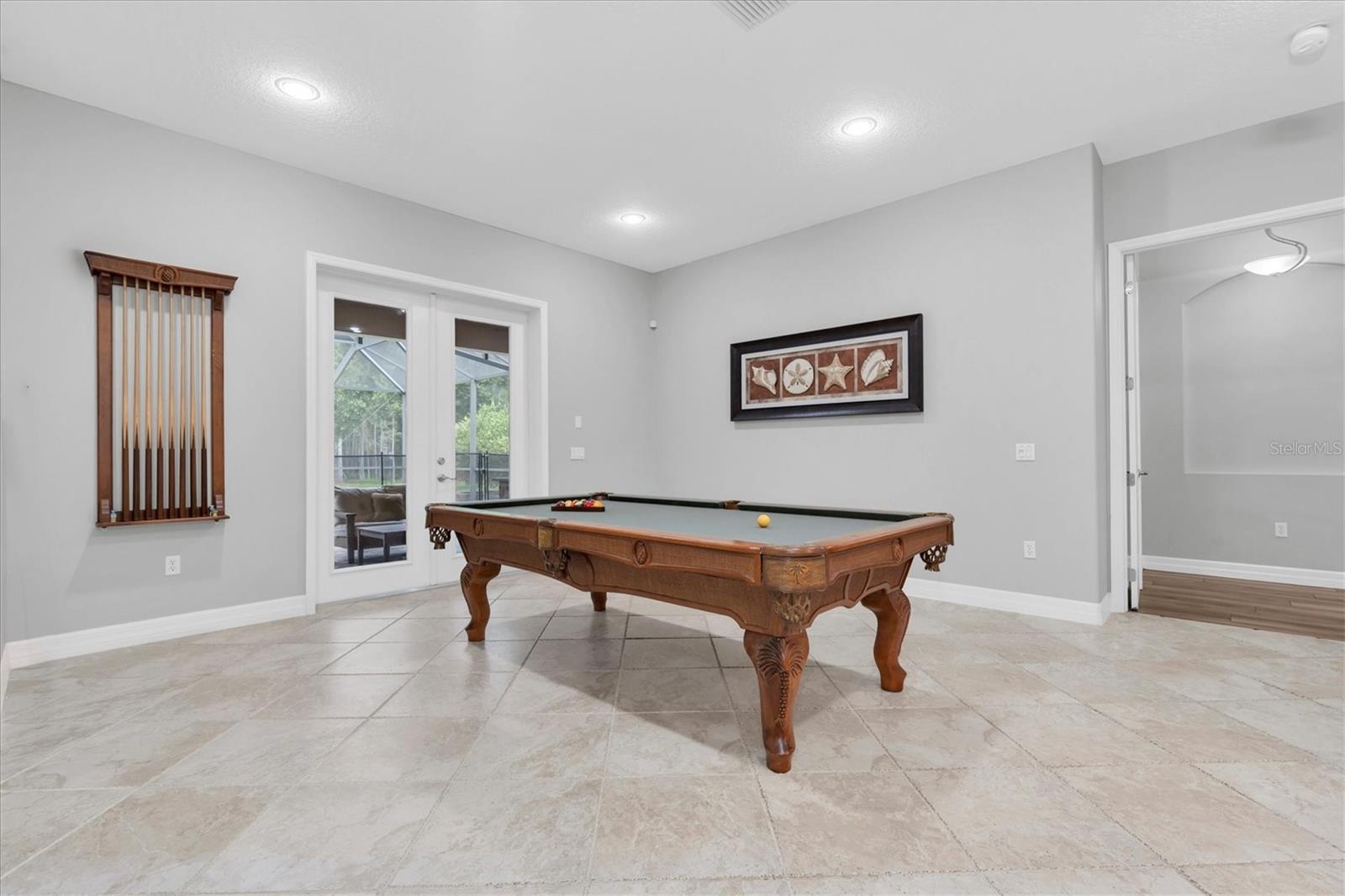Pool table room next to primary