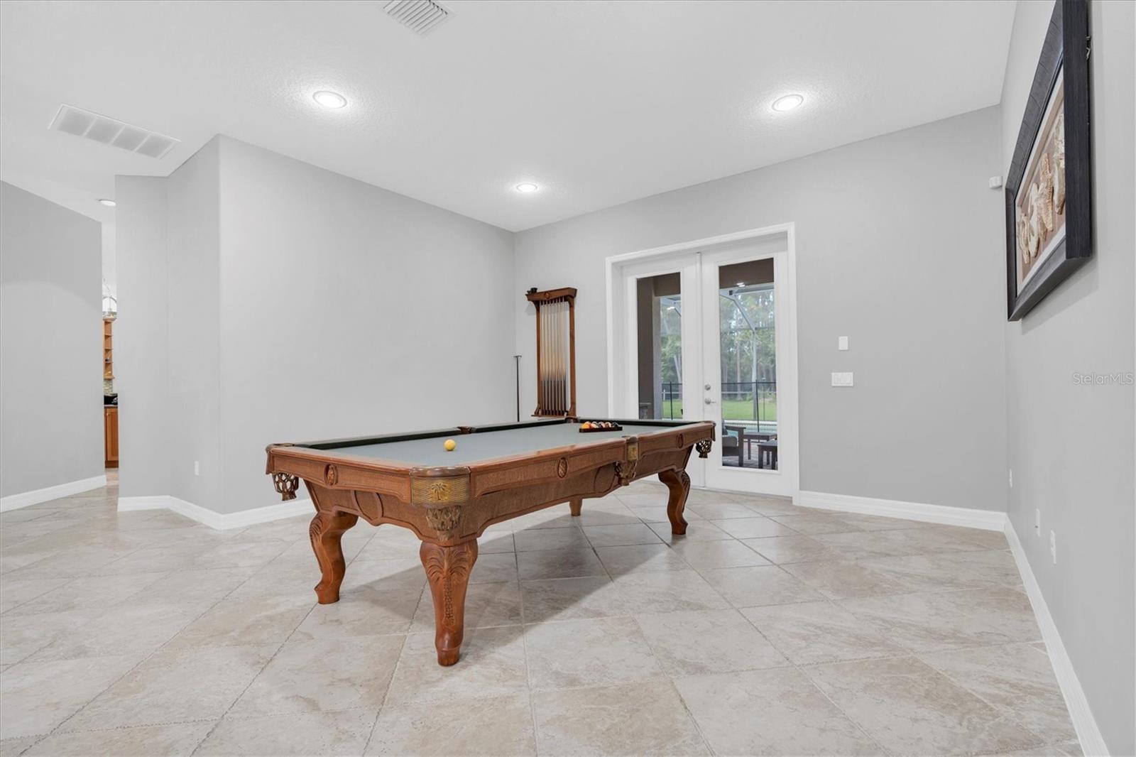 Pool table room next to primary