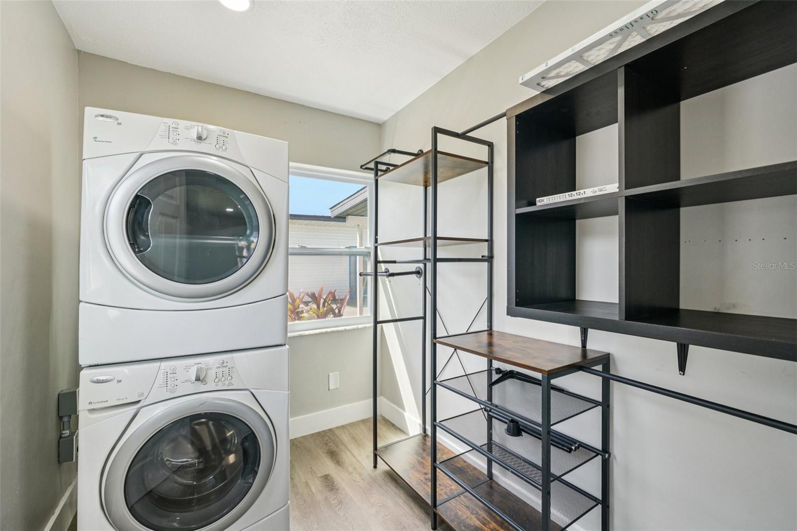 Primary bedroom walk-in closet with Washer and Dryer
