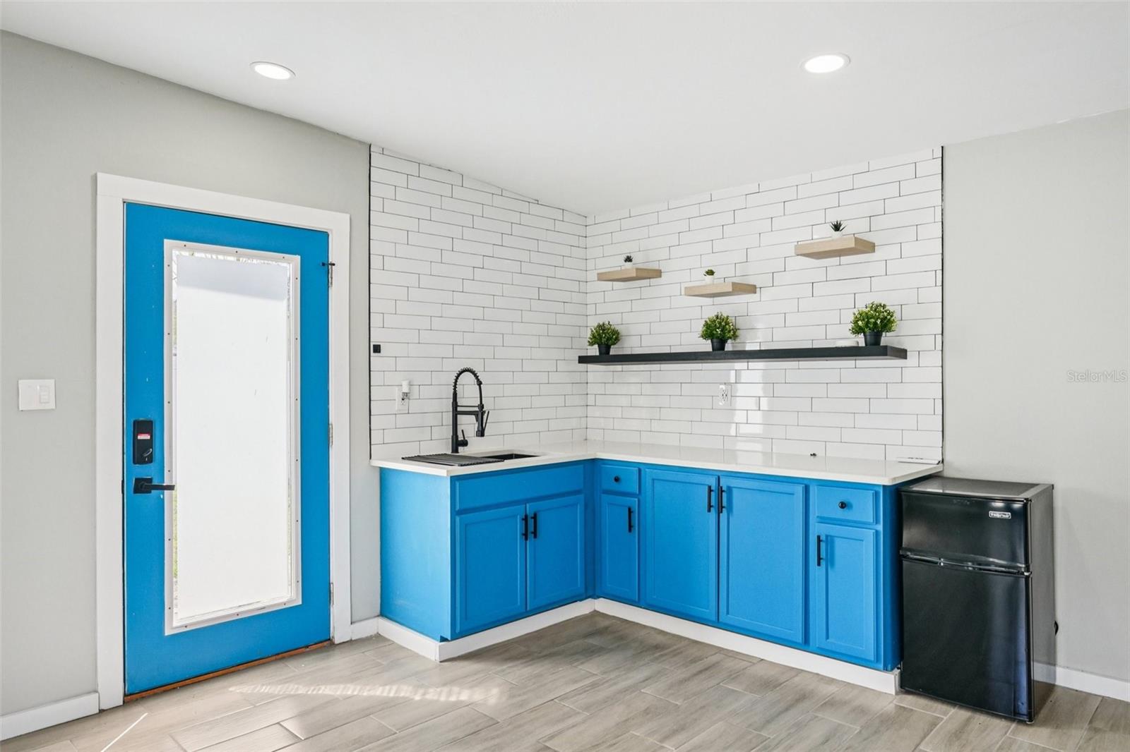 Detached Studio with separate AC, Laundry, Kitchenette and full bathroom.