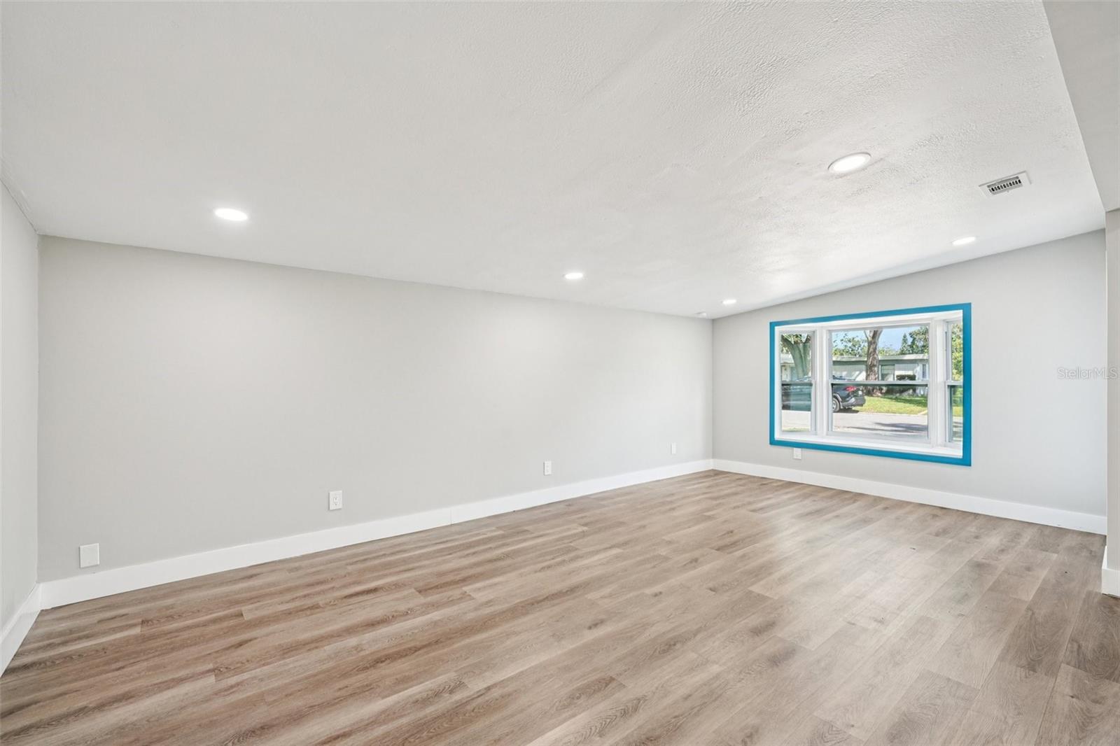 Open living area with beautiful luxury vinyl flooring flowing throughout