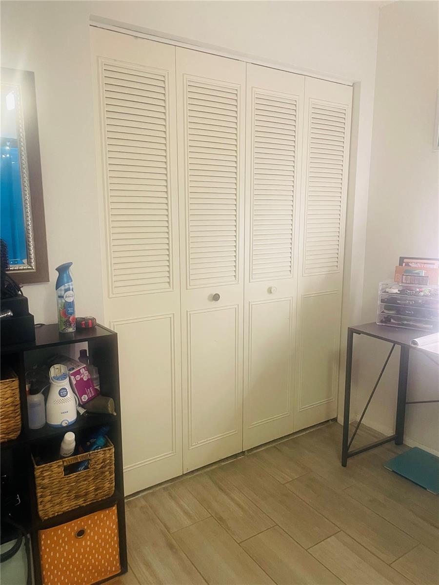 Large bedroom closet with bifold doors allowing full access.