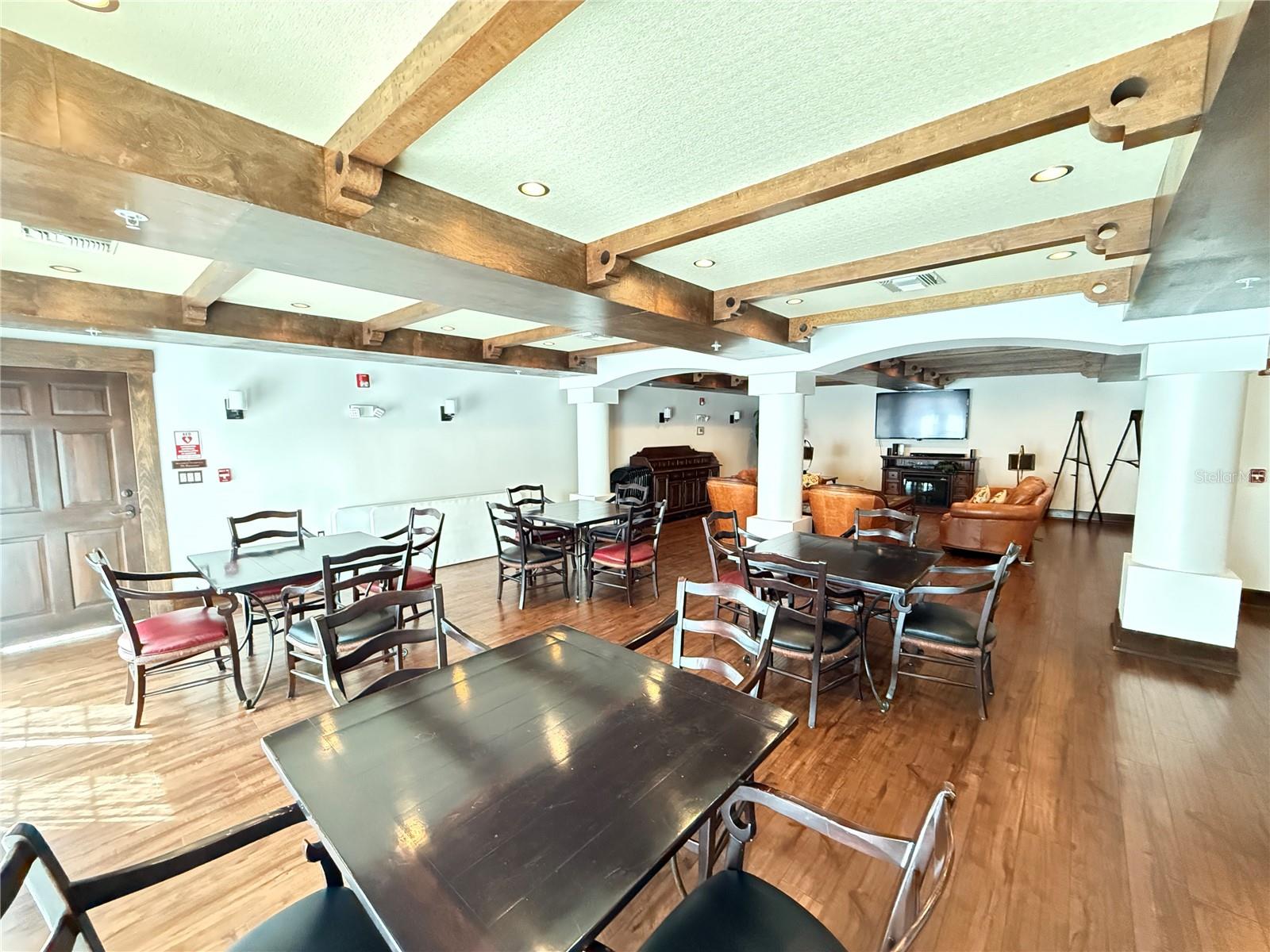 Tables and chairs for enjoying group get together meals   Located just off the Courtyard as well.