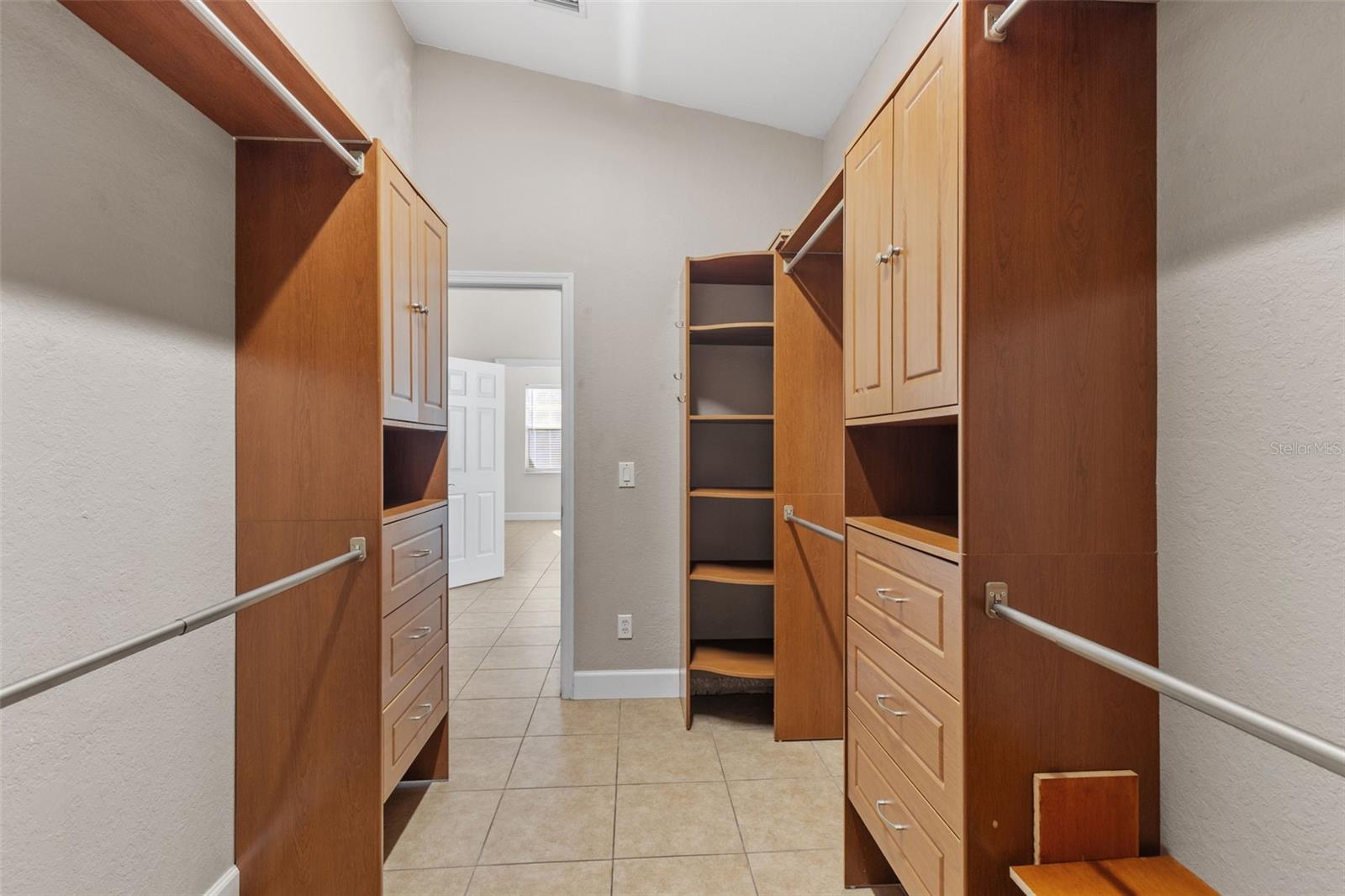 Primary Walk in Closet with Built-ins
