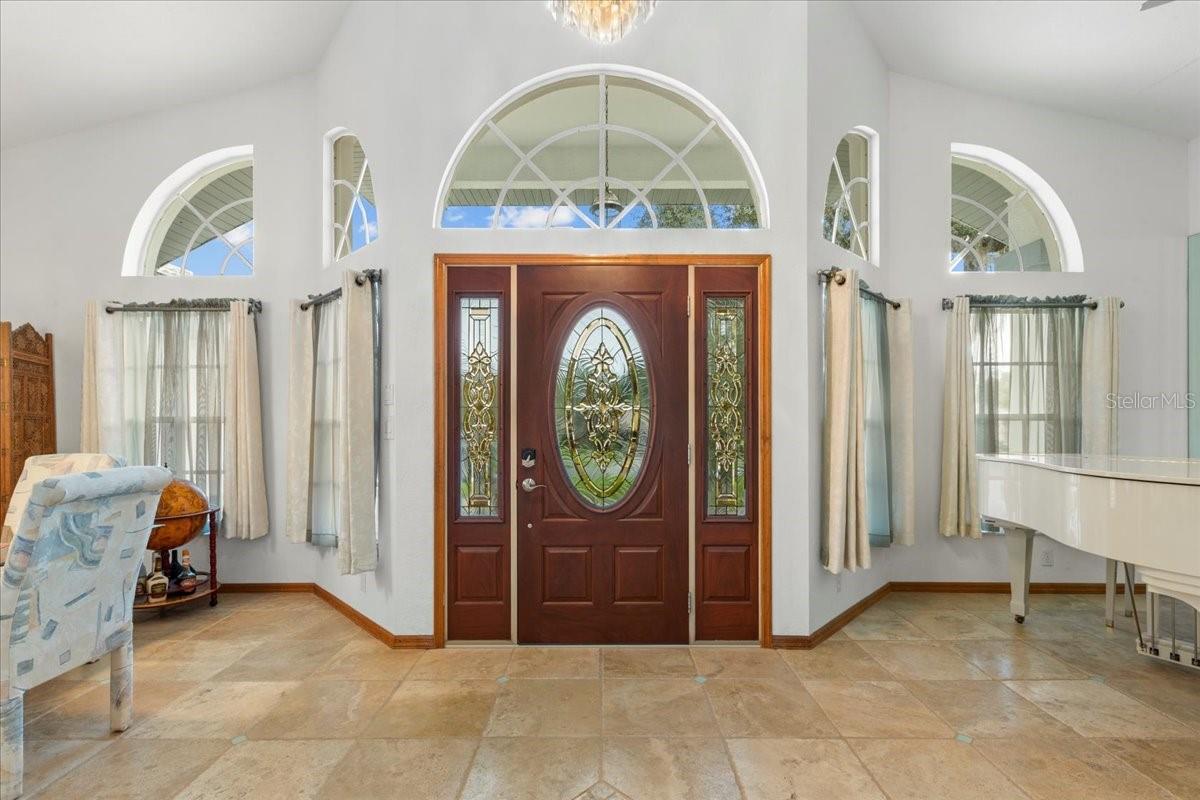 Foyer with travertine flooring