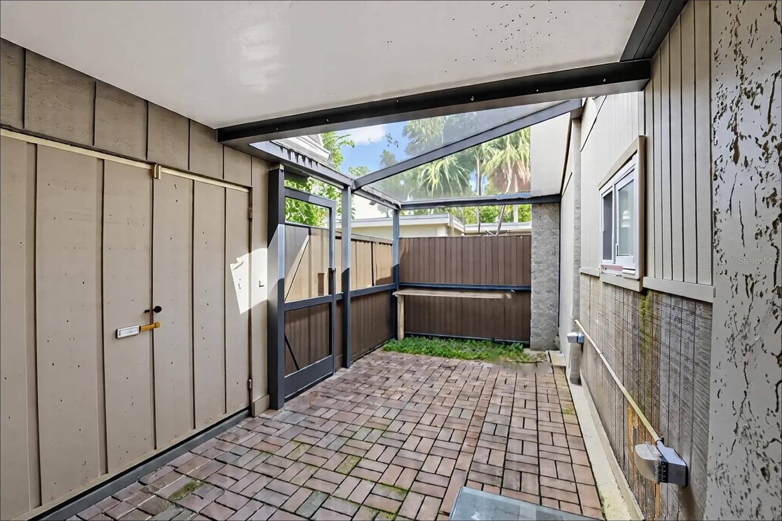 Front courtyard with private storage.