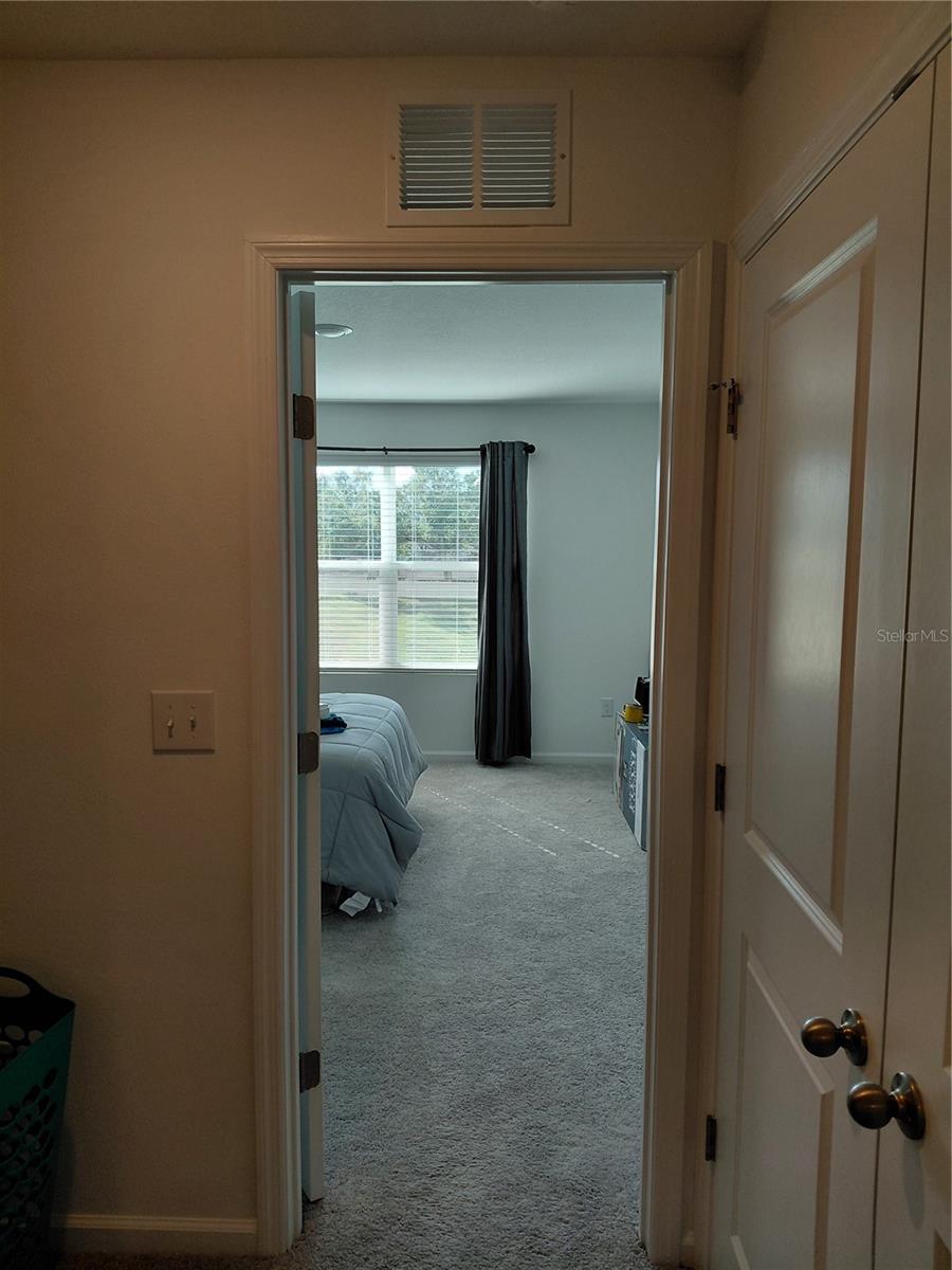 Upper level hallway to master bath