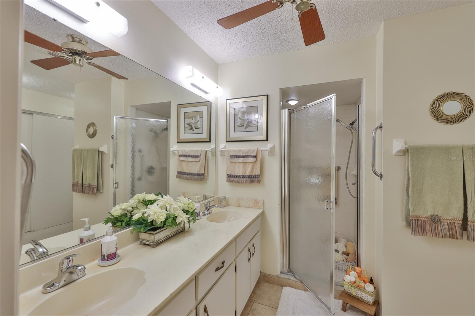 Private shower and stall in the Primary Bathroom