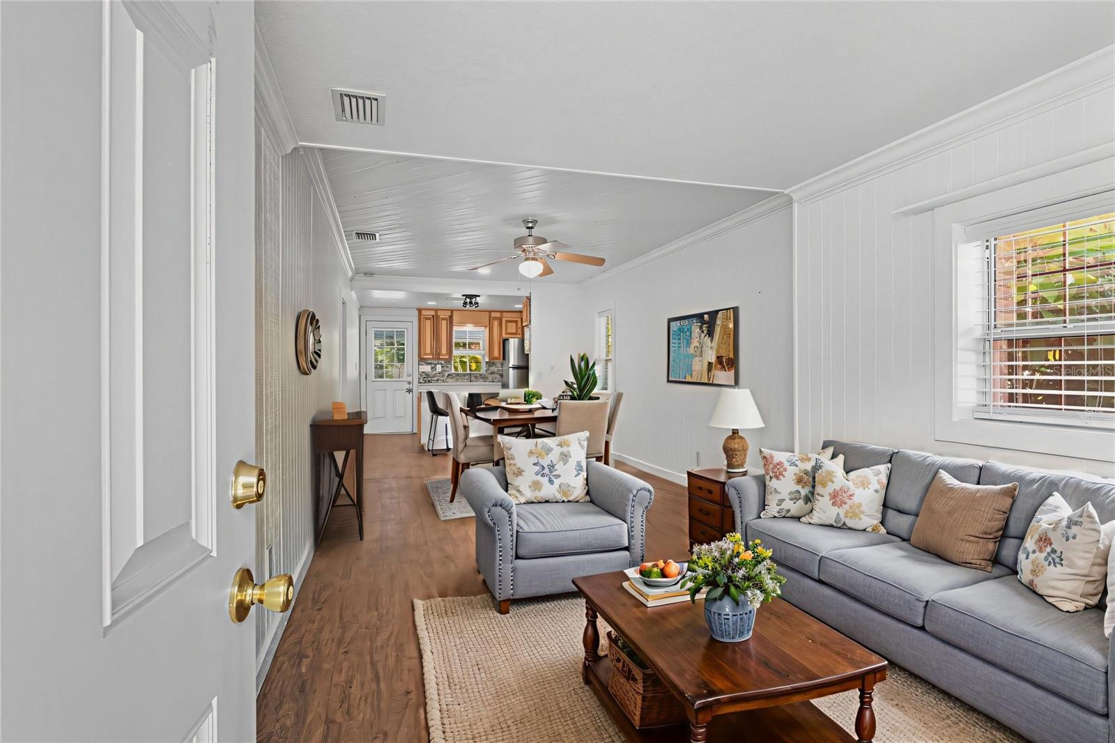 A bright and versatile space at the front of the home, perfect for a cozy seating or dining area.
