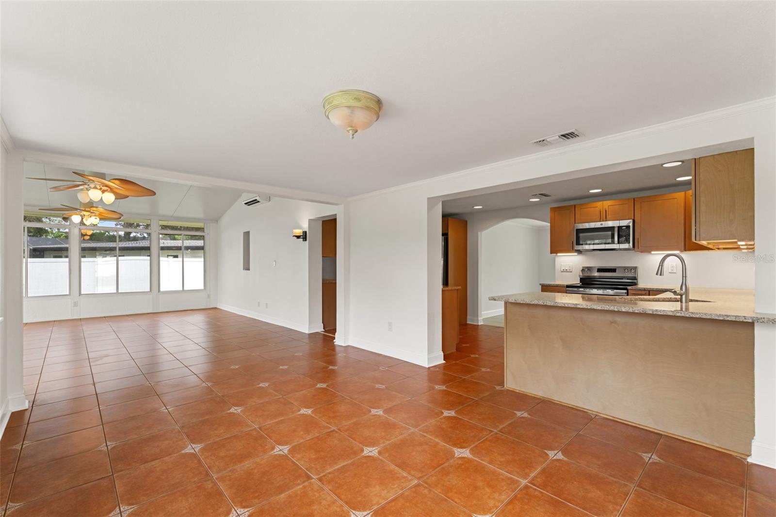 Open concept connects the dining and kitchen areas, perfect for gatherings or casual meals.