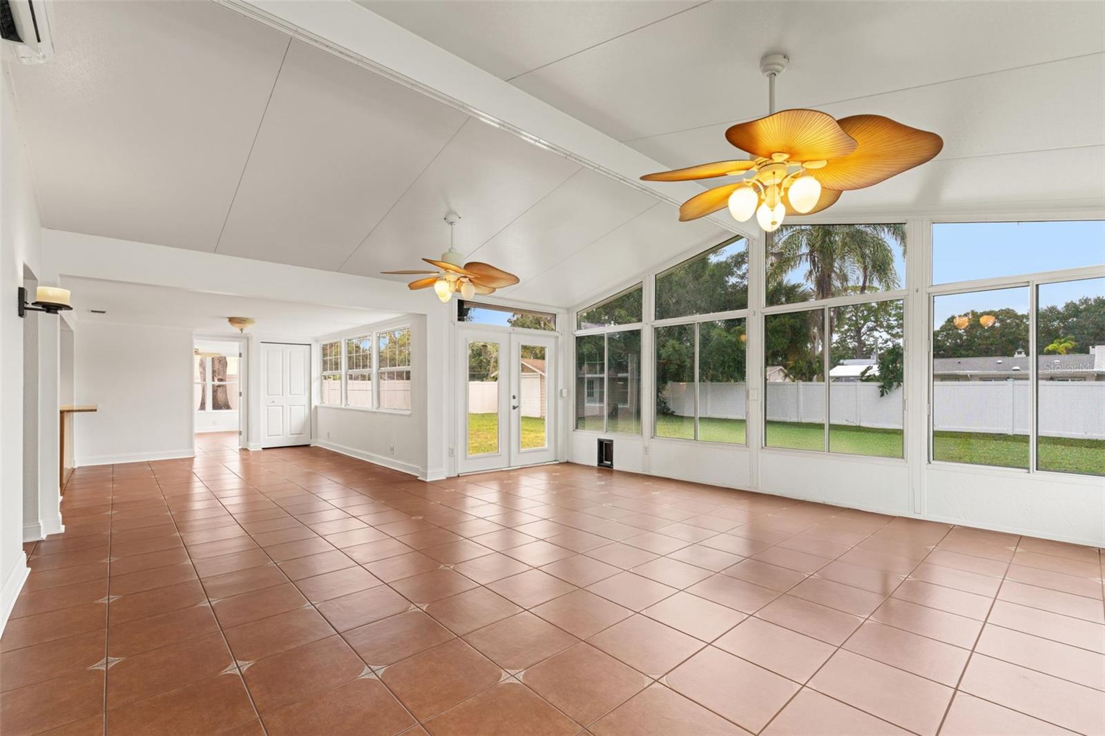 Glass doors lead directly to the fenced backyard, blending indoor and outdoor living effortlessly.