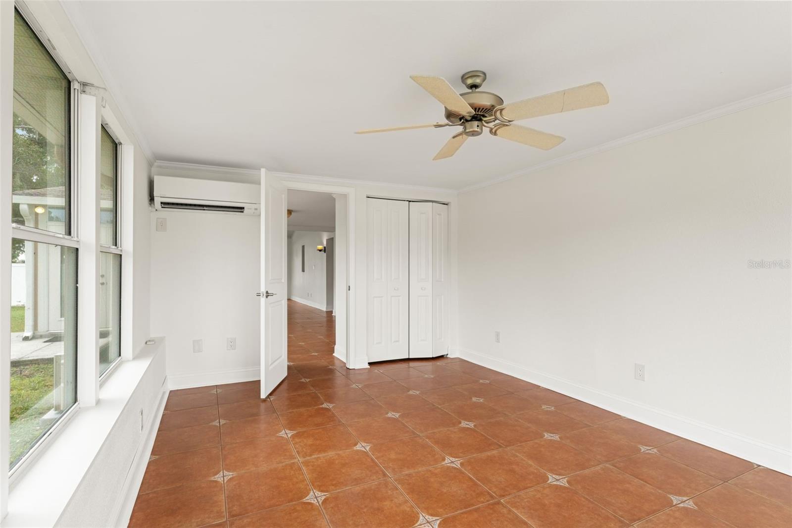 Offers a spacious closet and easy access to the main living area, providing both privacy and convenience.