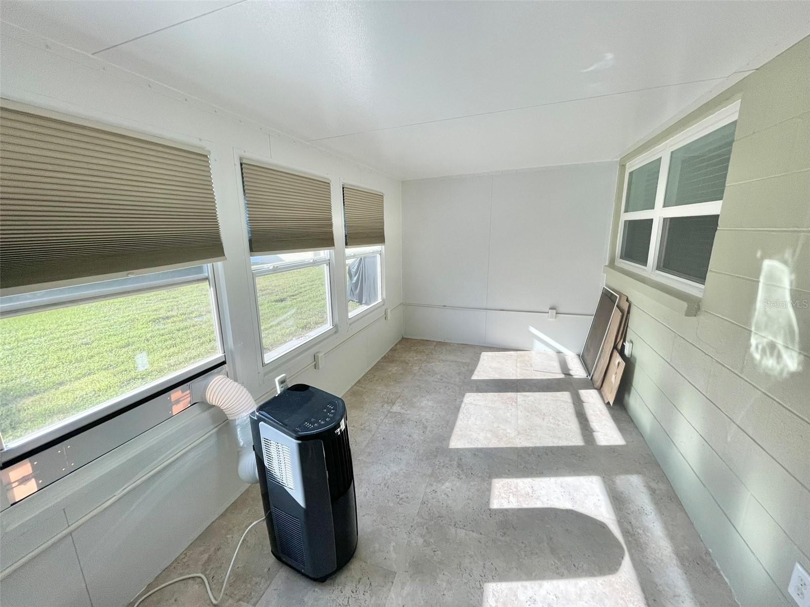 Florida room with portable AC for the hotter days!