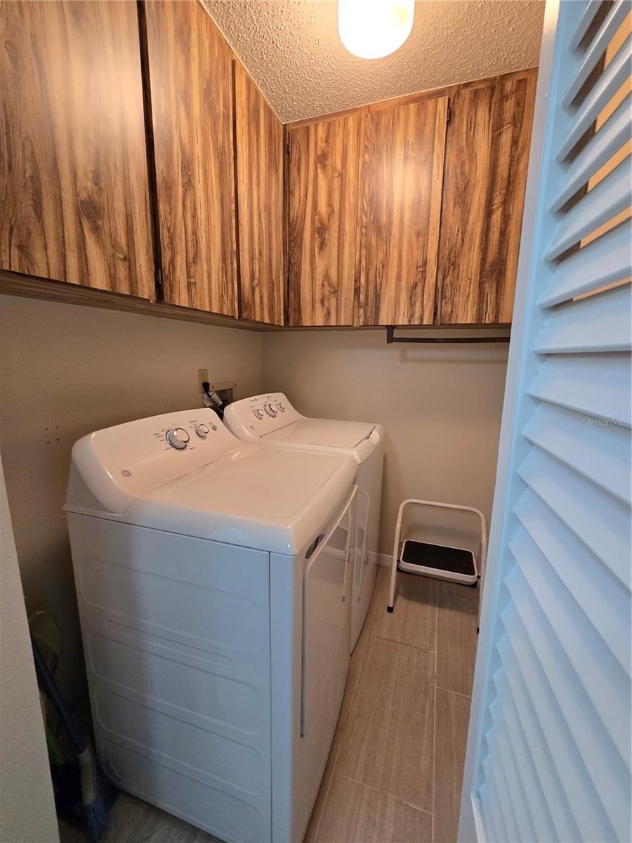 INDOOR LAUNDRY ROOM WITH NEW WASHER & DRYER