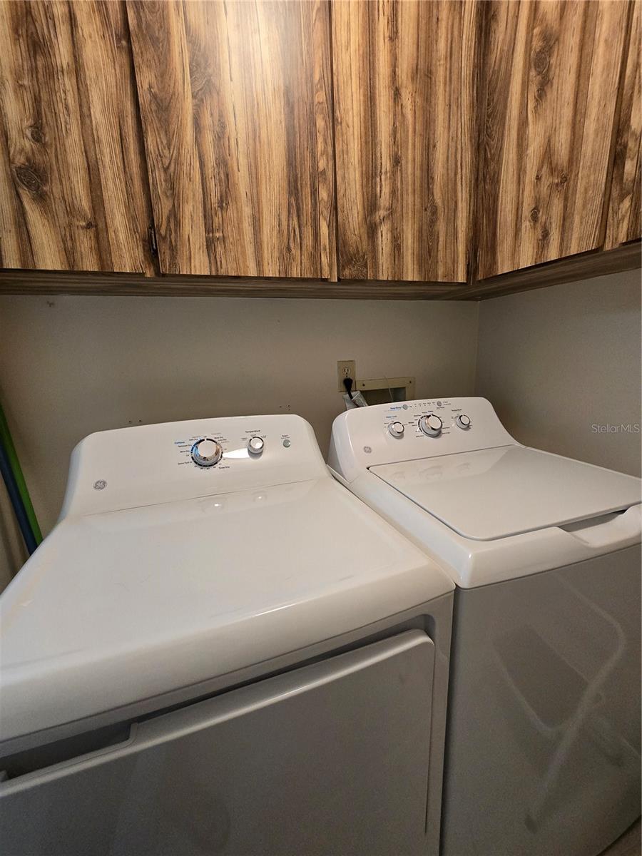 INDOOR LAUNDRY ROOM WITH NEW WASHER & DRYER