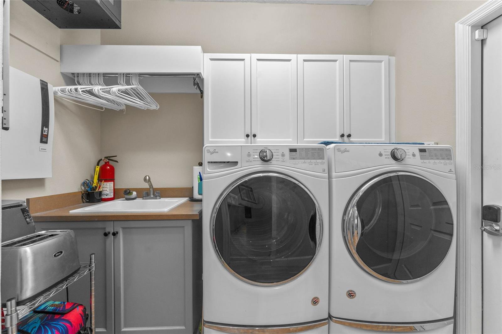 Interior Laundry Room with Sink and Extra Storage