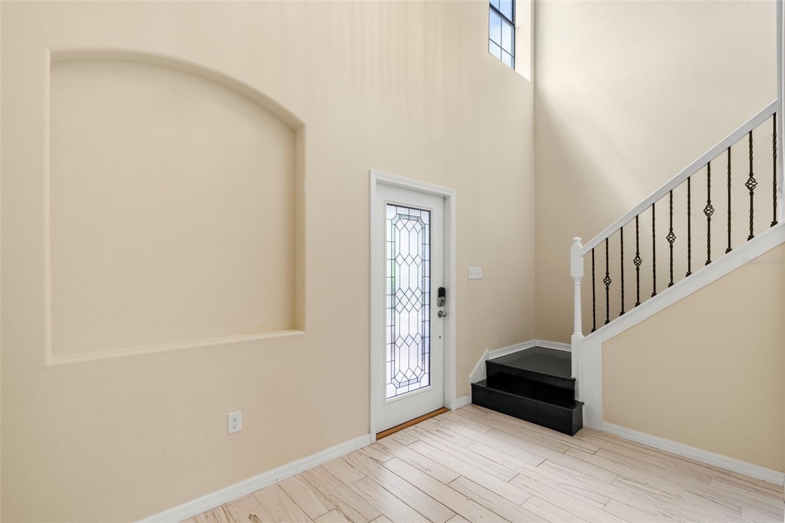 2-story soaring ceiling in the large foyer upon entering this beautiful home