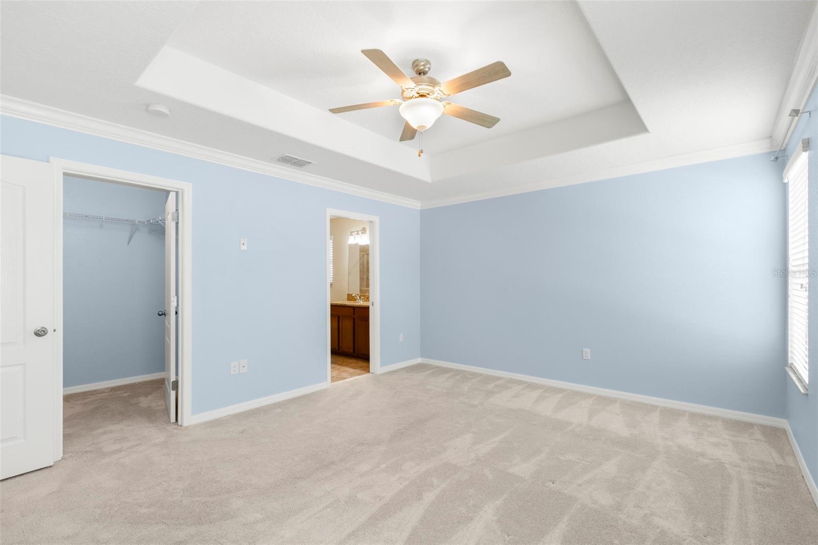 Primary Bedroom Suite with large walk-in closet and En Suite Bathroom.