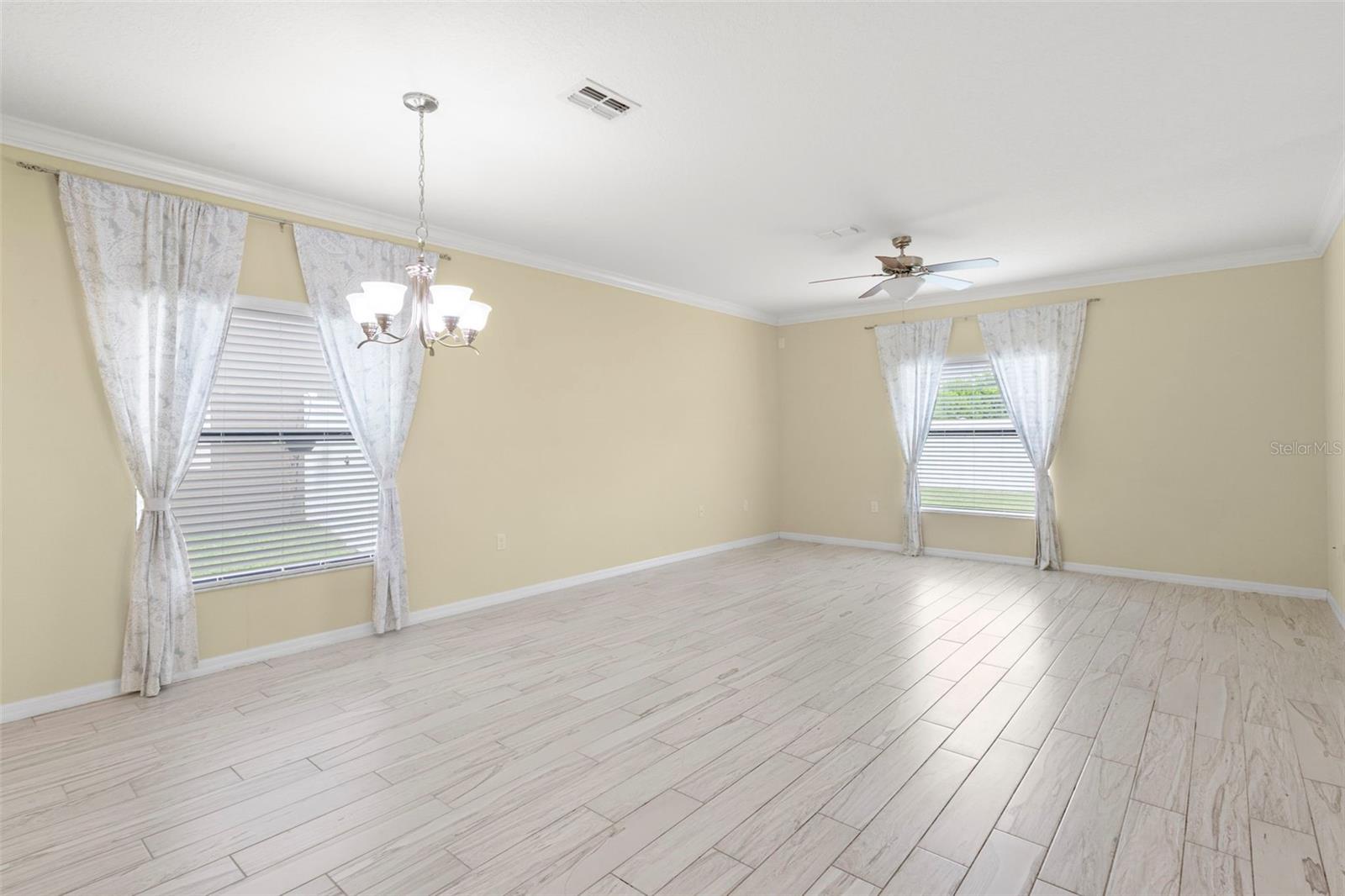 Open Dining/Living Room with crown molding