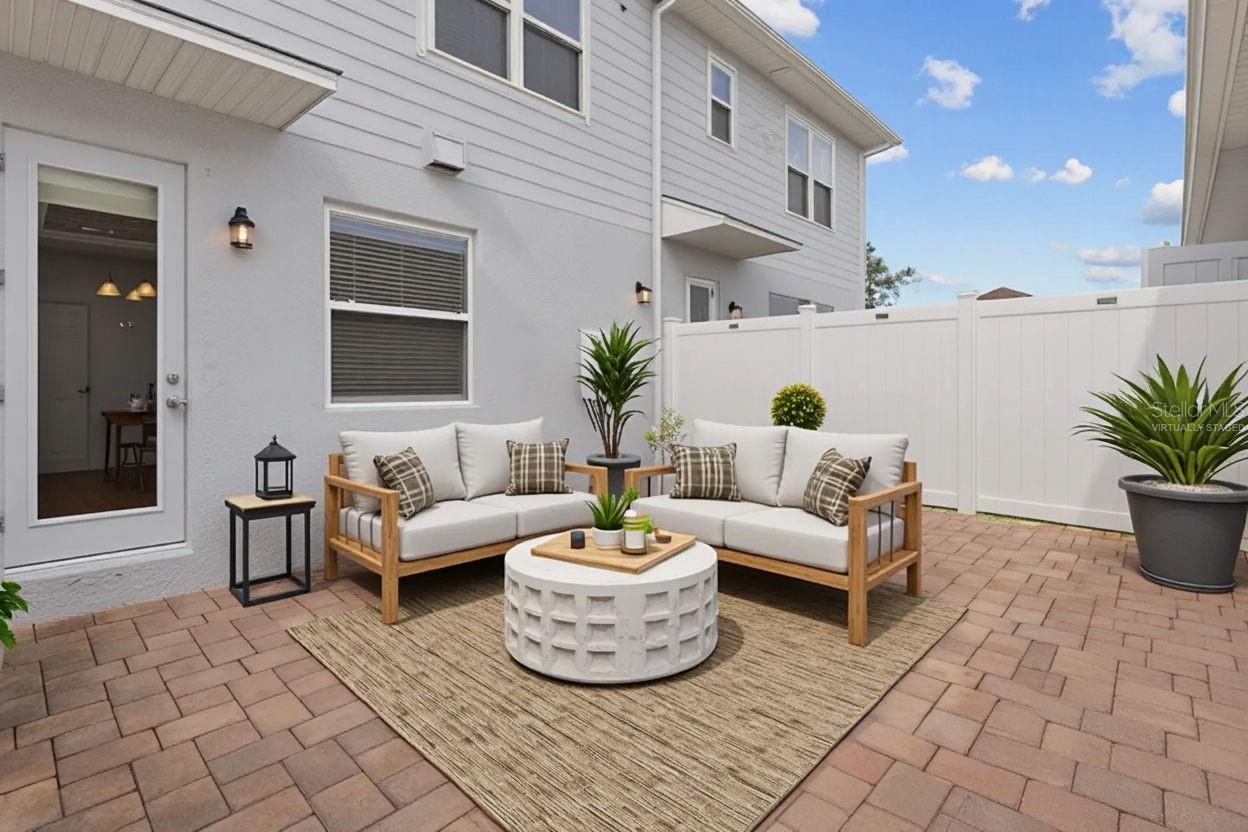 Courtyard leading to 2 car garage - virtually staged
