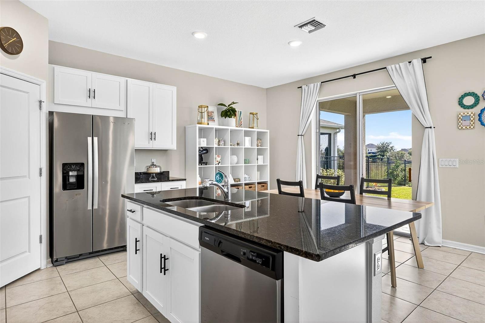 Enjoy looking out to your fenced in yard while eating or preparing a meal.