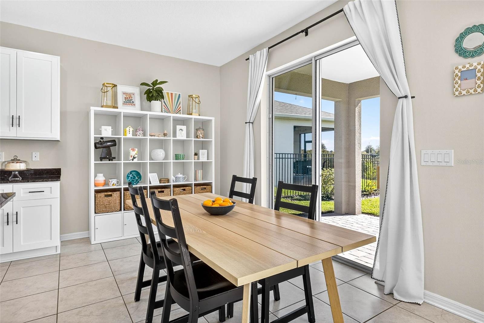 Add a buffet or additional storage space in the dining area.