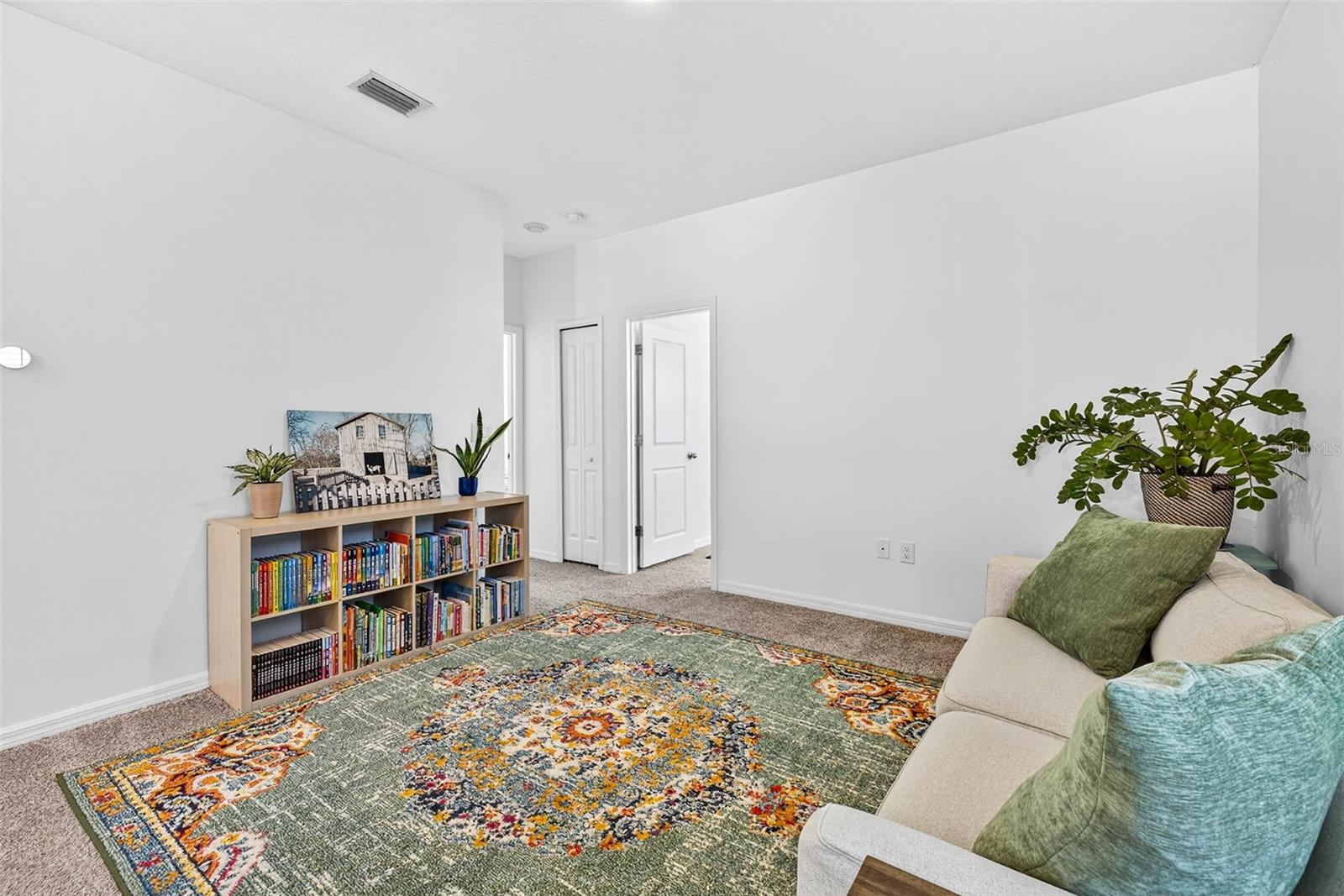 2nd story loft divides the 3 bedrooms in the split floorplan.