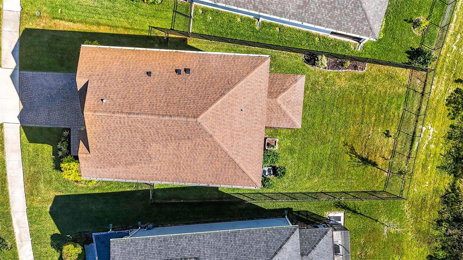 Large yard with extra wide lot on each side between the homes.