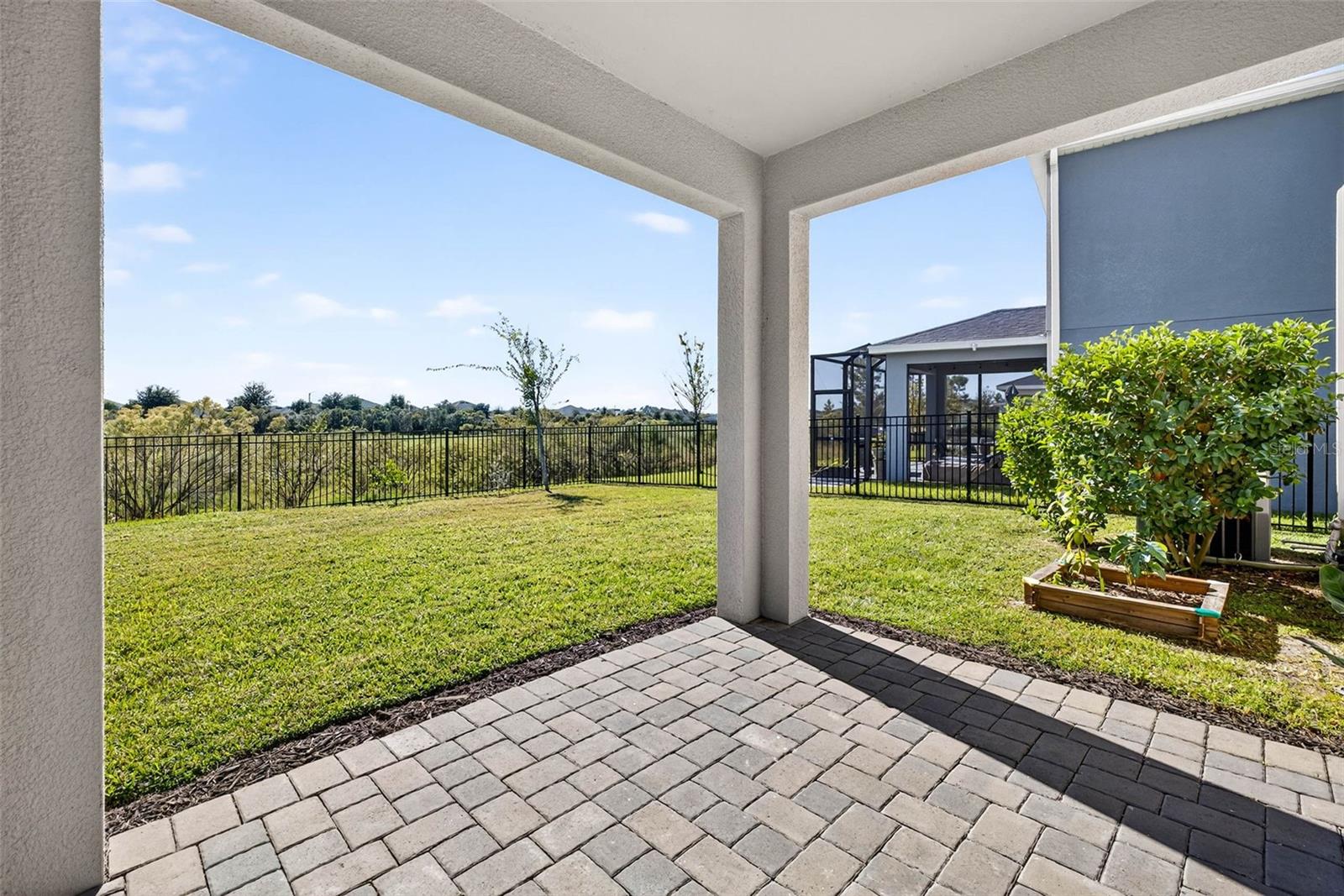 Large fenced-in yard with lanai.
