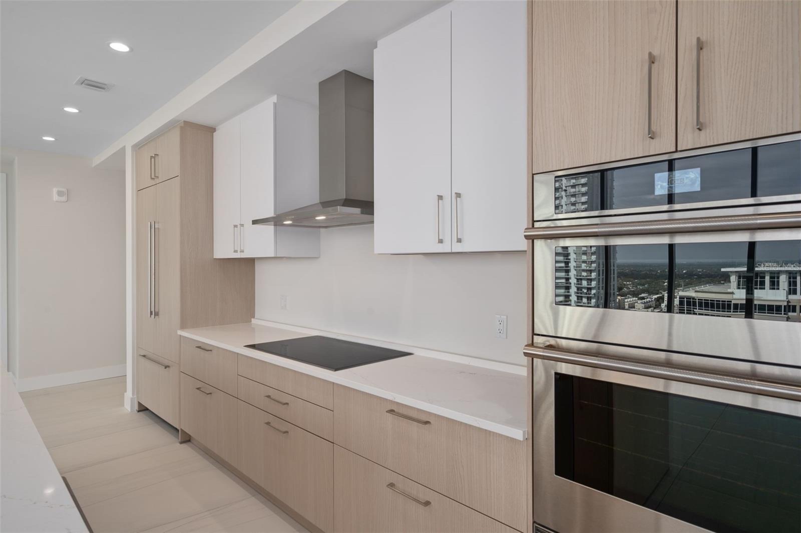 Quartz Counters, Euro Cabinetry, Jenn-Air Appliances